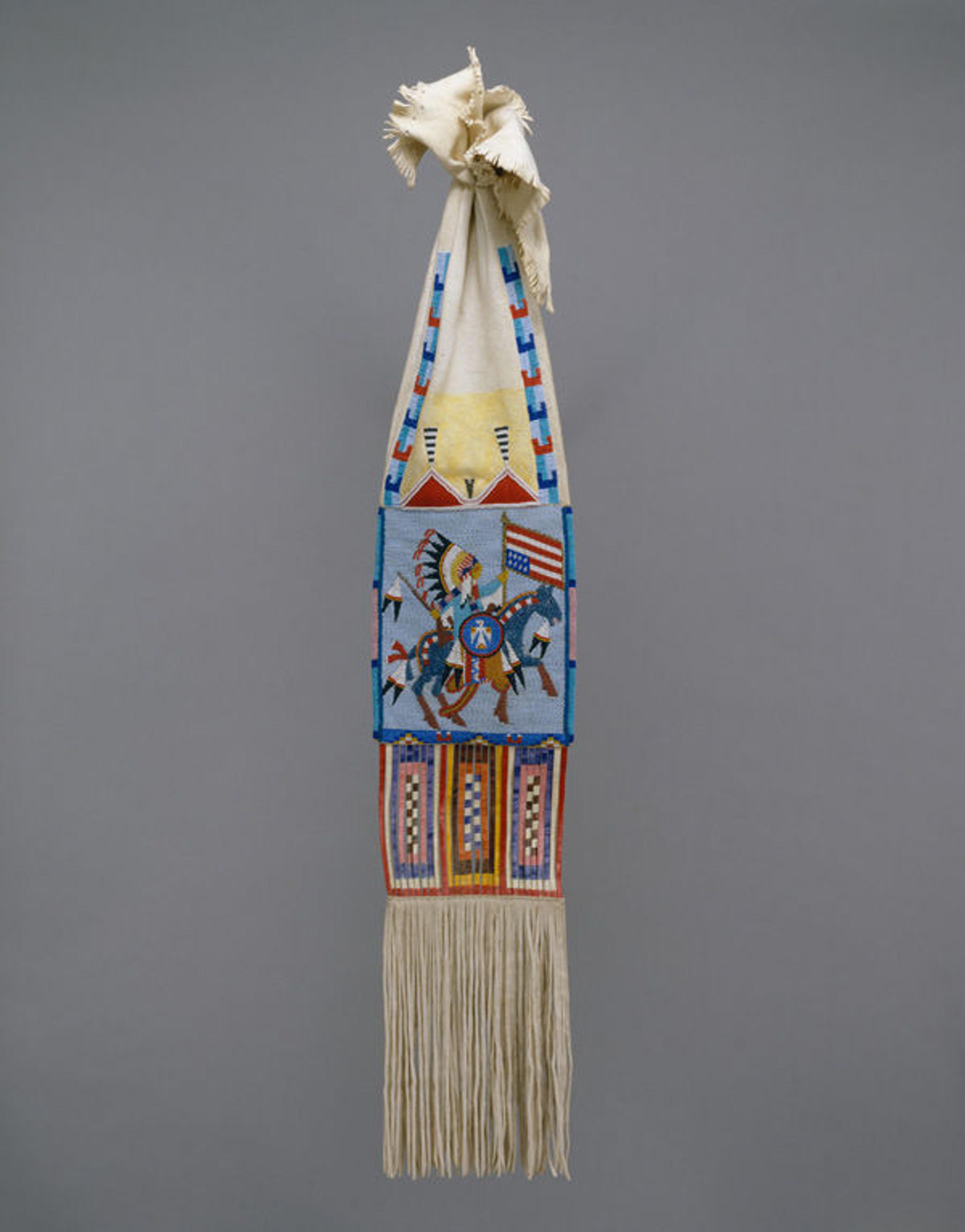 Joyce Growing Thunder Fogarty (Native American, born 1950). Tobacco Bag, 1977. United States, Montana. Assiniboine or Sioux. Native-tanned deerskin, pigment, glass, quill, cloth; H. 40 x W. 8 in. (101.6 x 20.3 cm). The Metropolitan Museum of Art, New York, Ralph T. Coe Collection, Gift of Ralph T. Coe Foundation for the Arts, 2011 (2011.154.12)