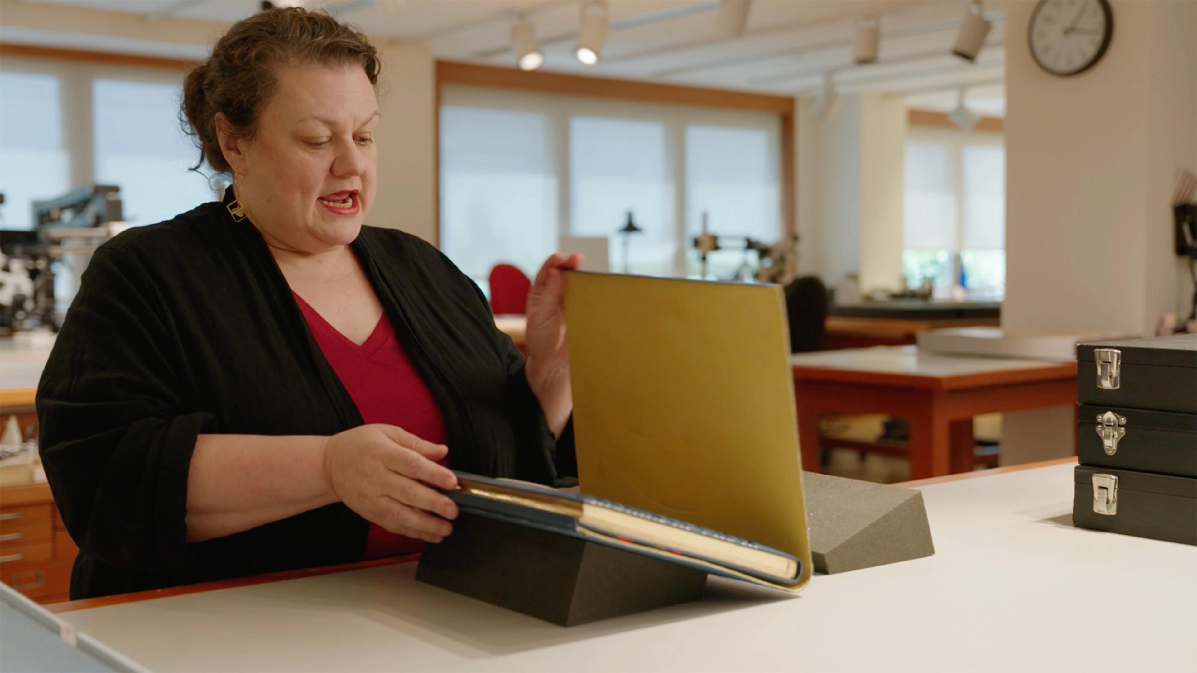 Image of conservator Rachel Mustalish talking about the luxury copy of La Fin du monde