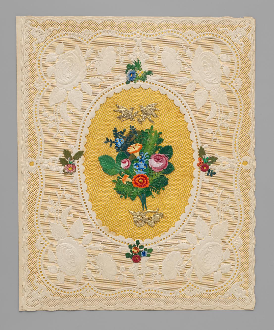 Cameo embossed lace paper valentine with collaged bouquet of die cut printed flowers on a yellow background.