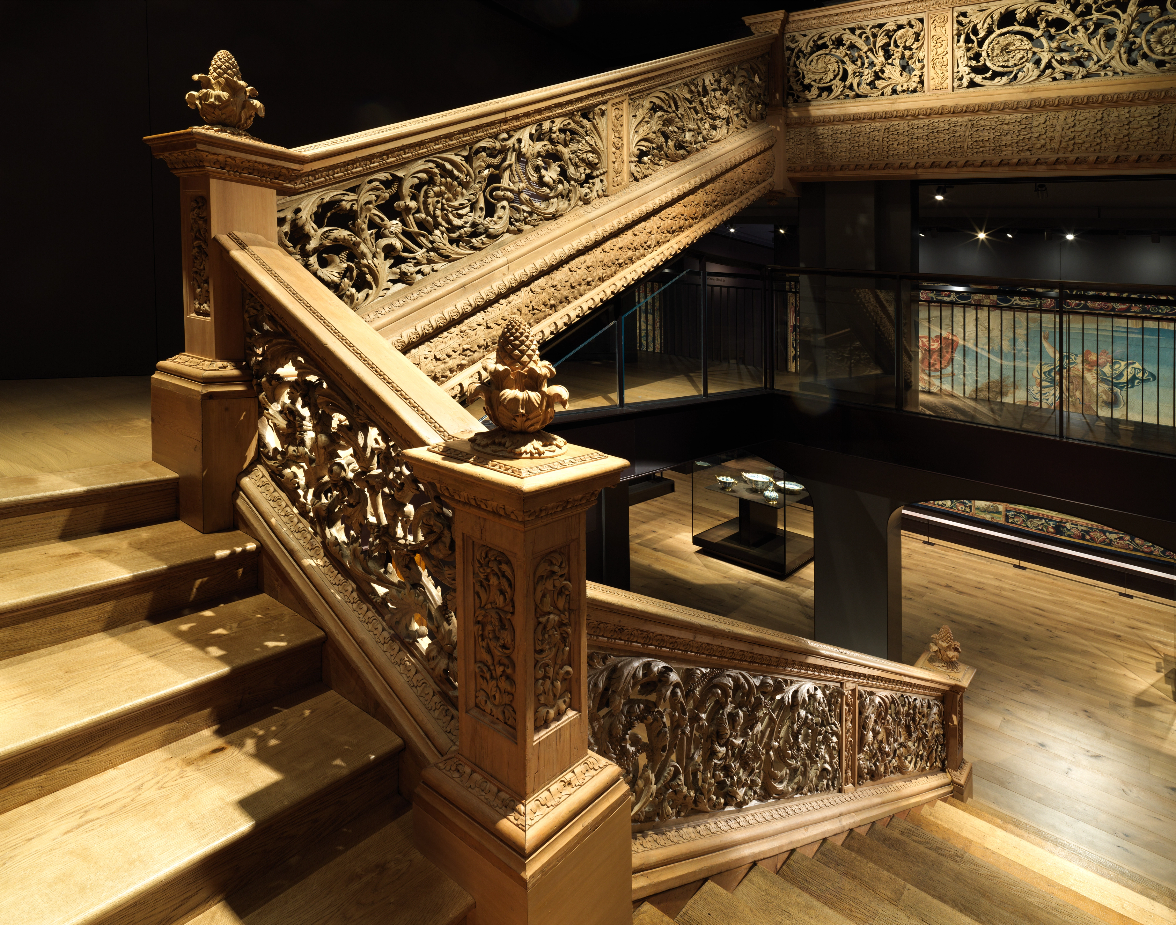 Wooden staircase carved with natural vegetal elements, as presented in 2020 installation of new British galleries.