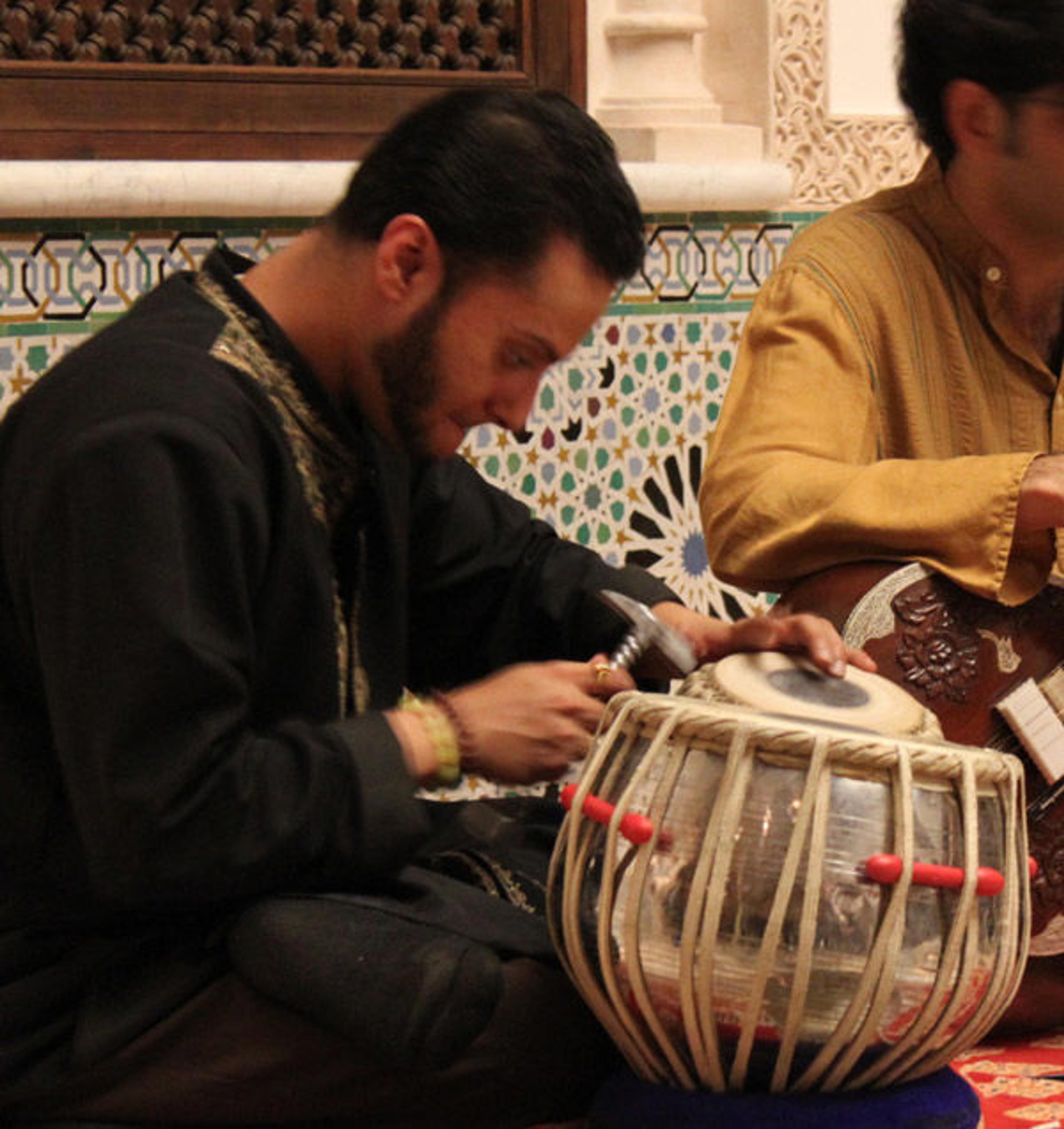 Shivalik Ghoshal tunes the tabla as Neel Murgai continues playing on the sitar.