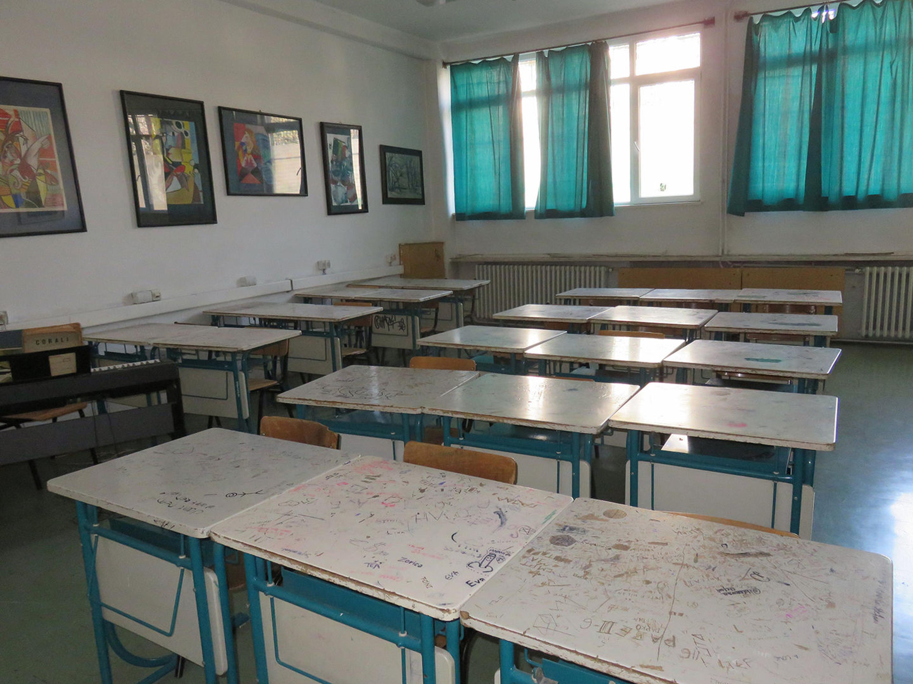 School classroom with bright and green desks and decorations