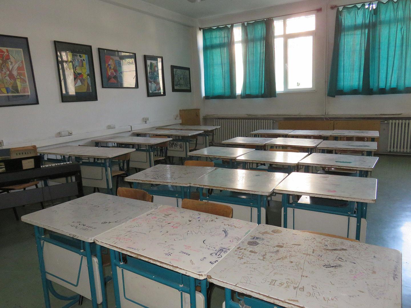 School classroom with bright and green desks and decorations