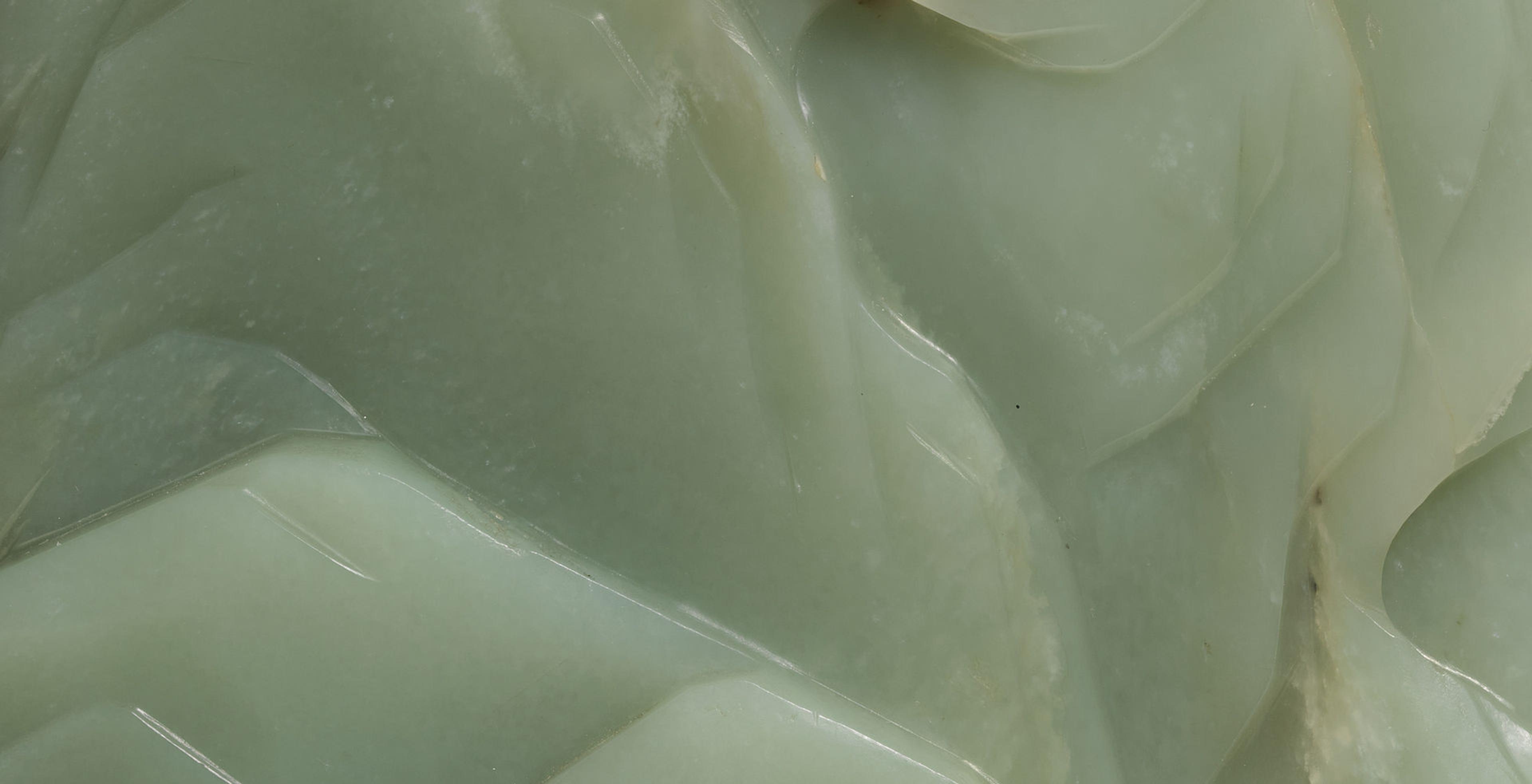Extreme close-up of a carved piece of green jade