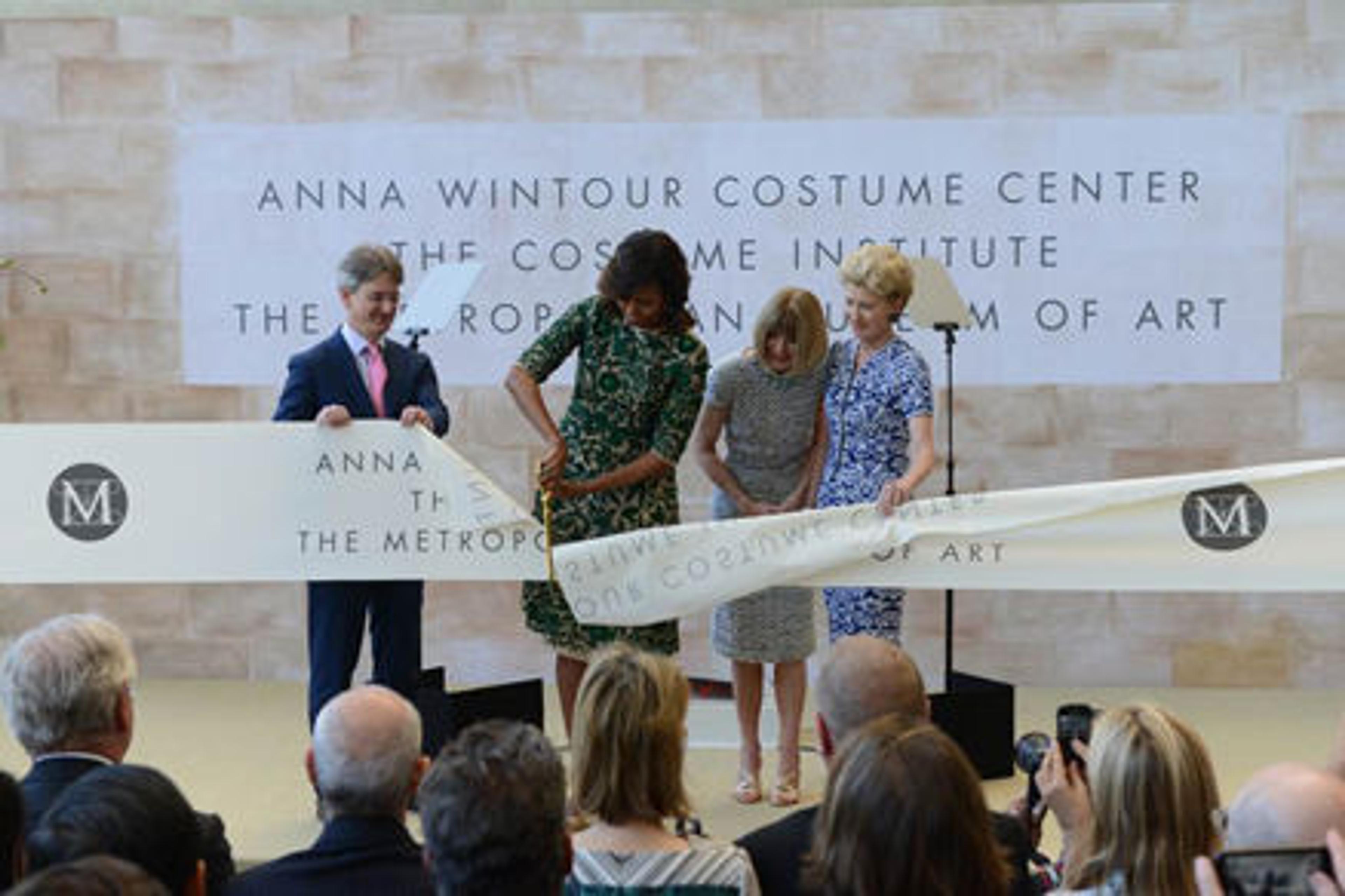 First Lady Michelle Obama cutting the ribbon to open The Costume Institute's new Anna Wintour Costume Center