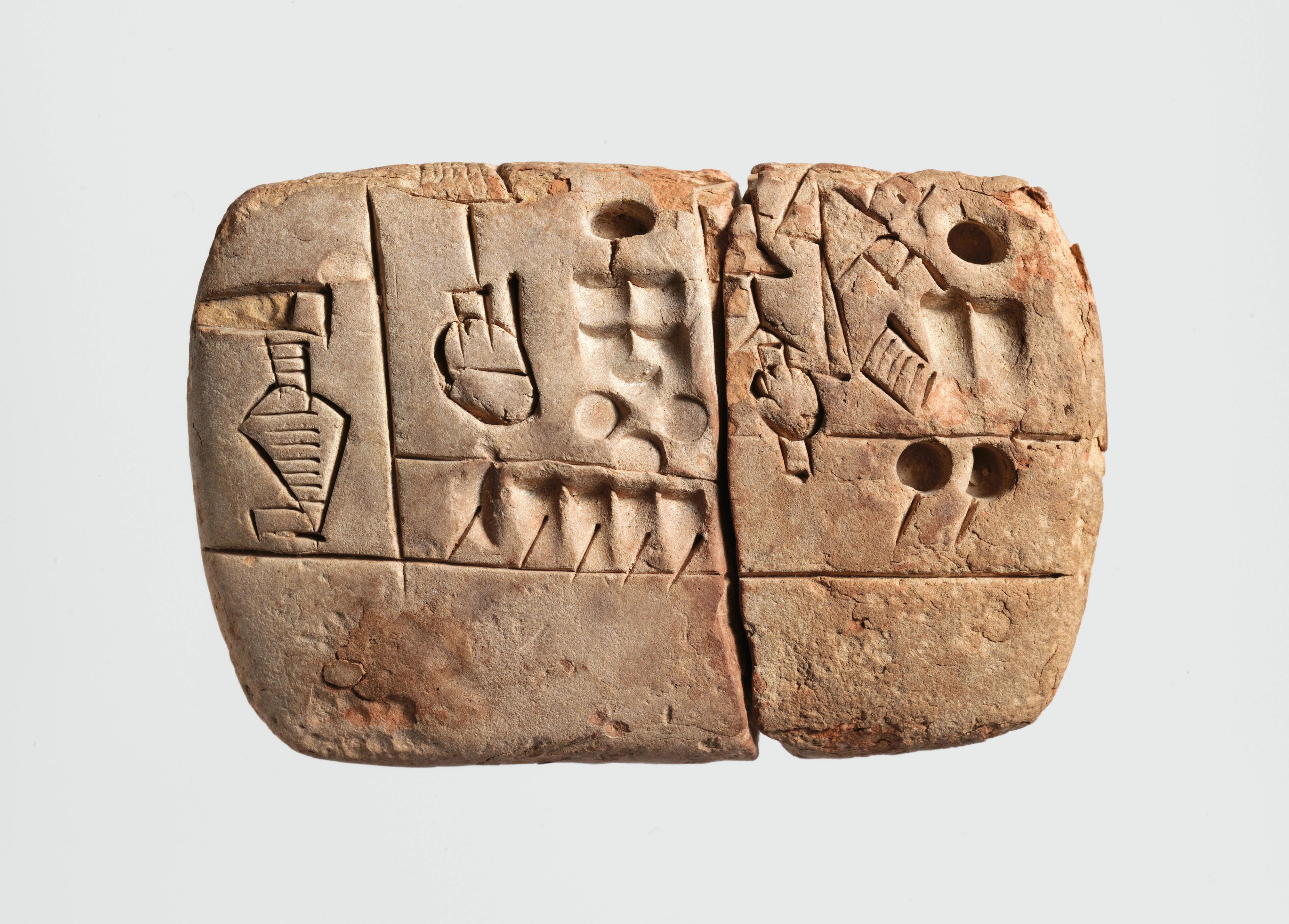 Retangular stone tablet carved with glyphs.