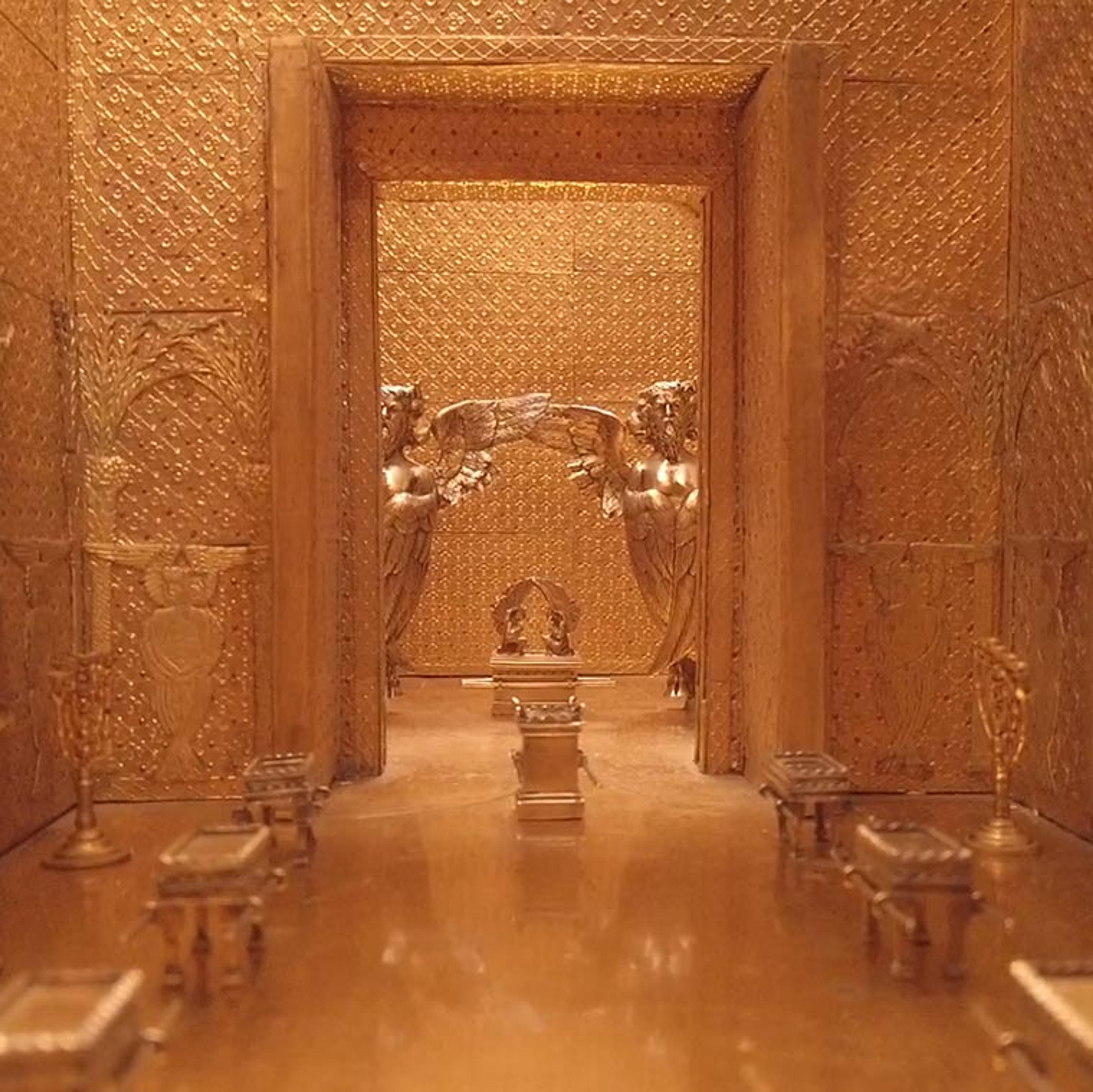 A golden hallway from an architectural model of an ancient temple