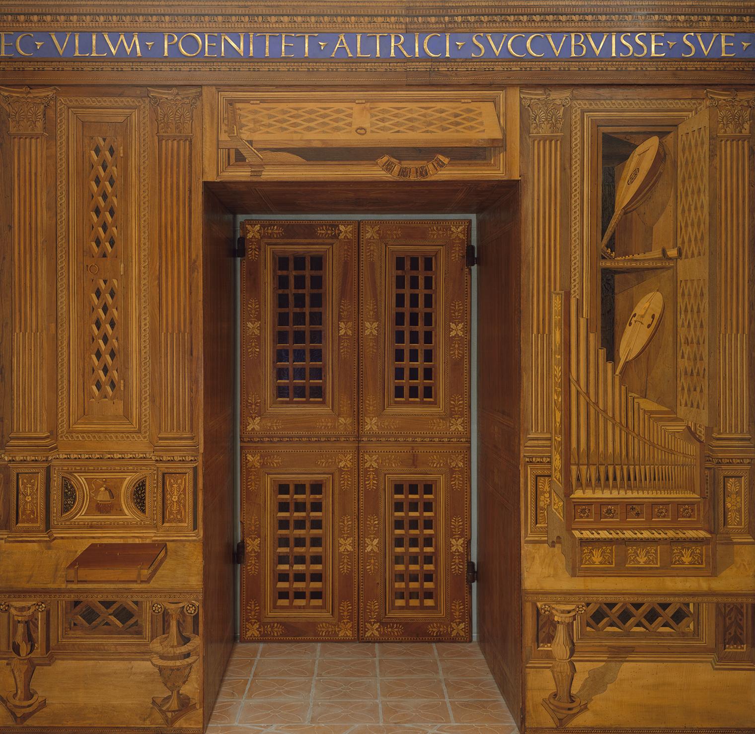 View of a doorway with detailed wood inlays, part of the Studiolo from the Ducal Palace in Gubbio