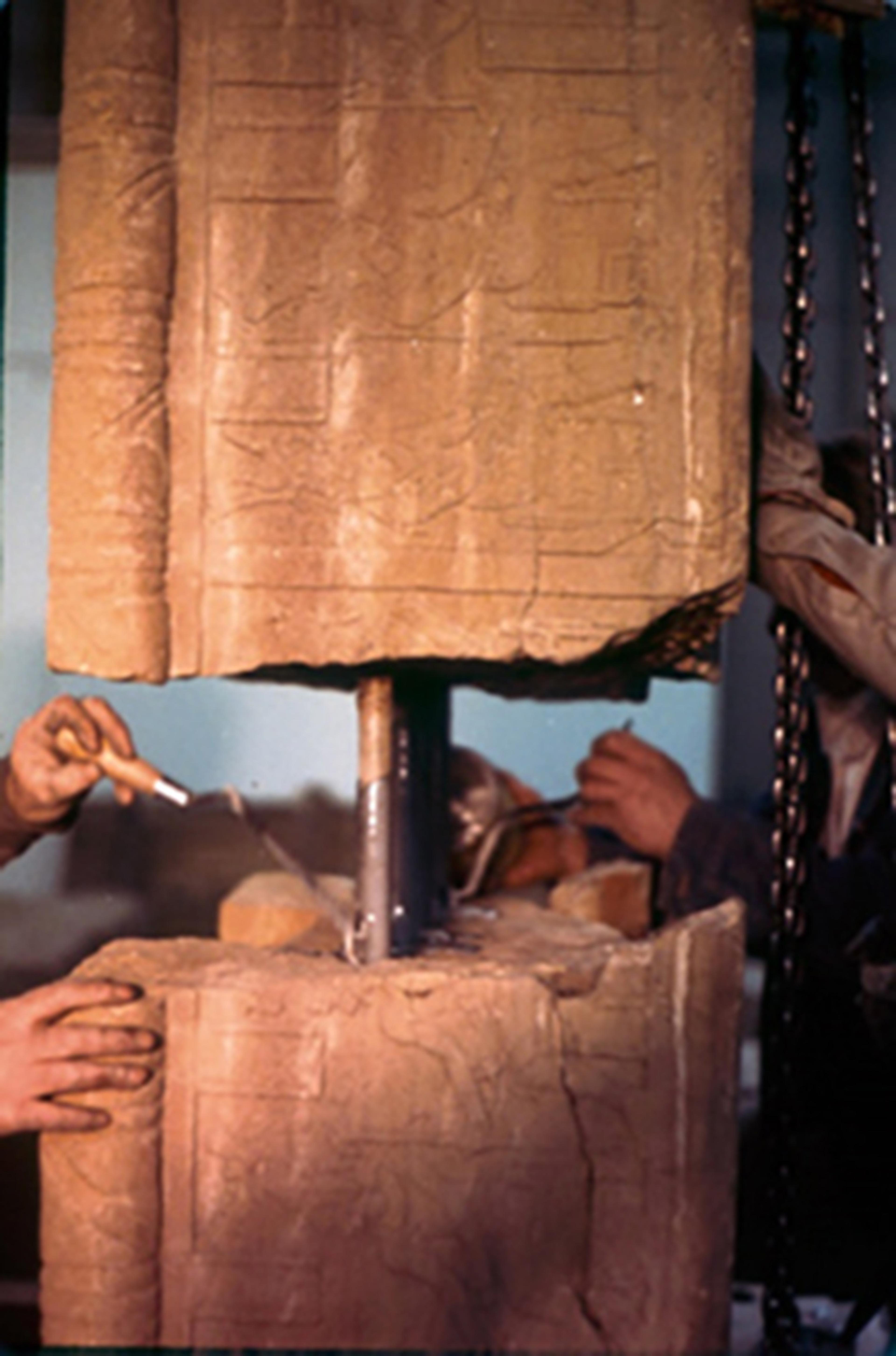 Two fragments of the temple are joined with steel rods and epoxy