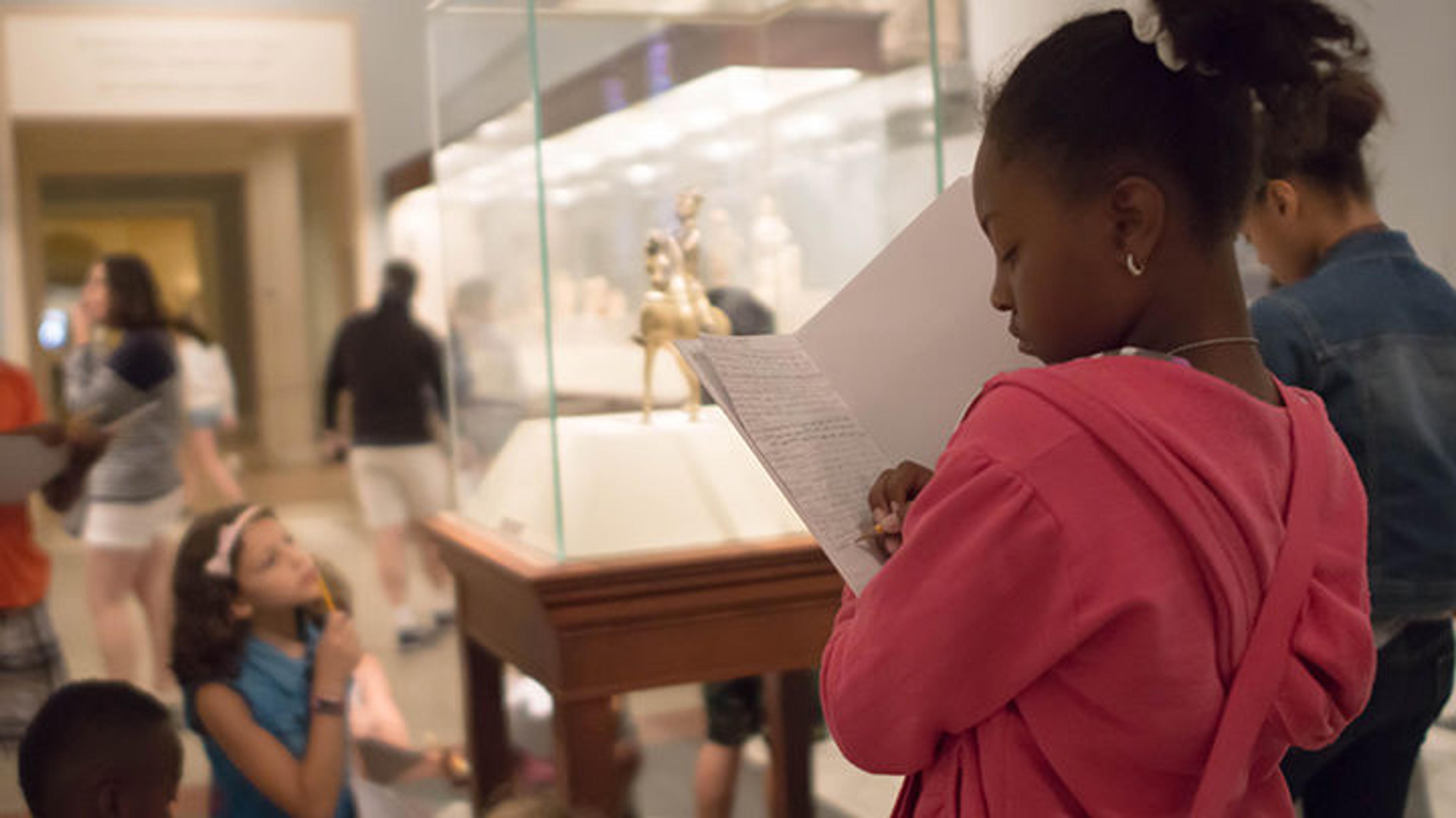 A girl taking notes for her story