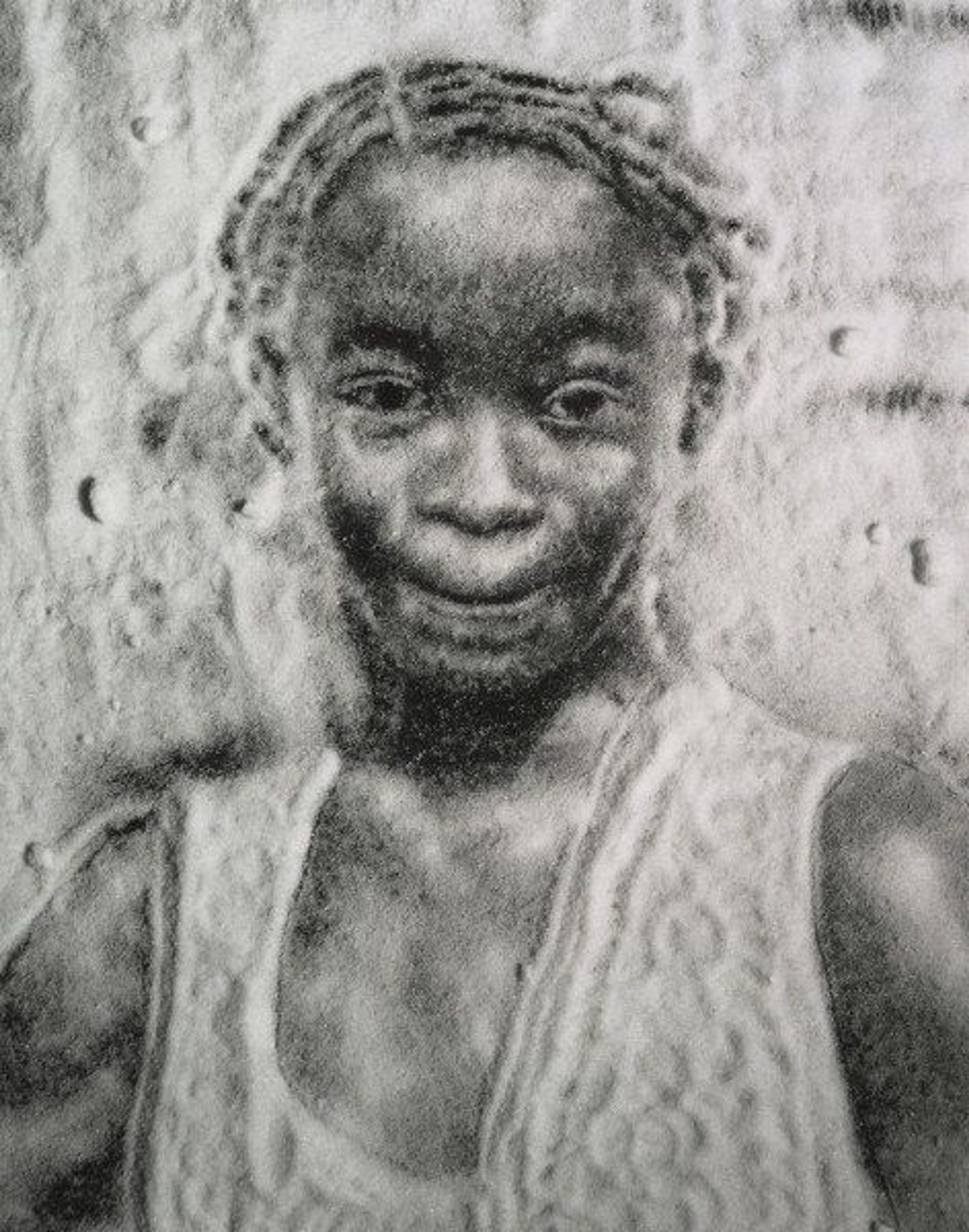 A black and white photograph of a portrait of a girl created by arranging sugar on black paper