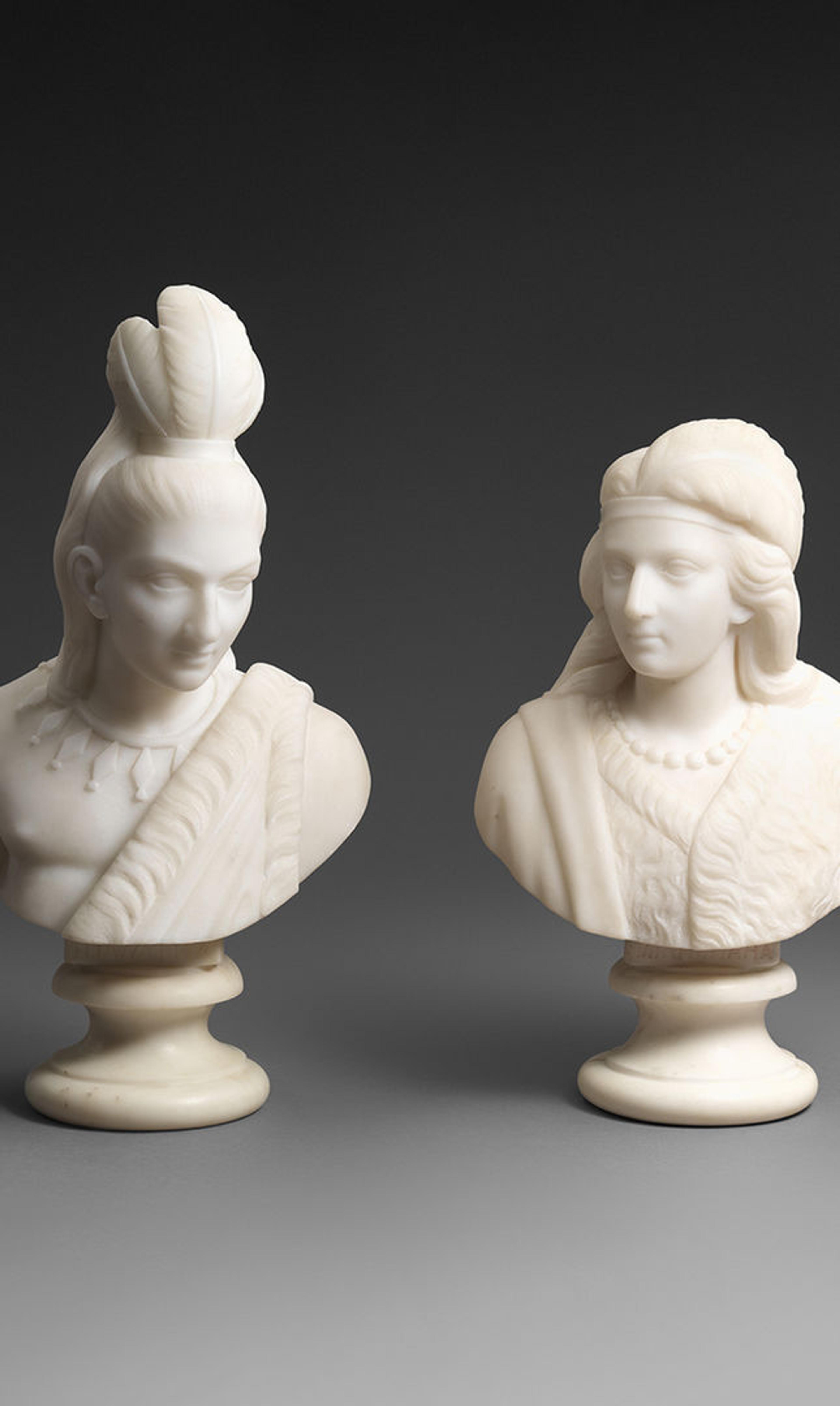 Two marble busts of Native American figures, Minnehaha and Hiawatha.