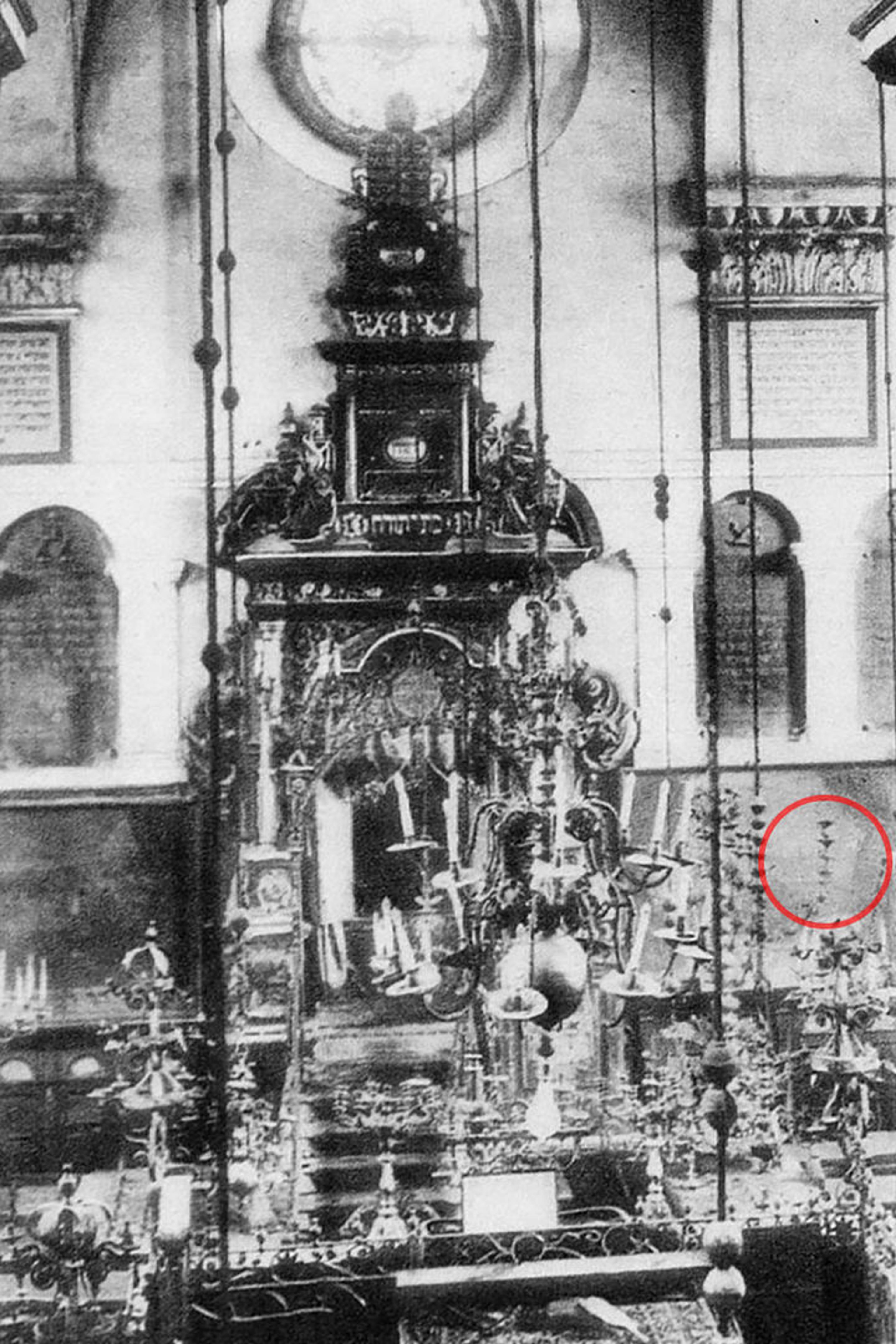 An old photo of a synagogue filled with artifacts
