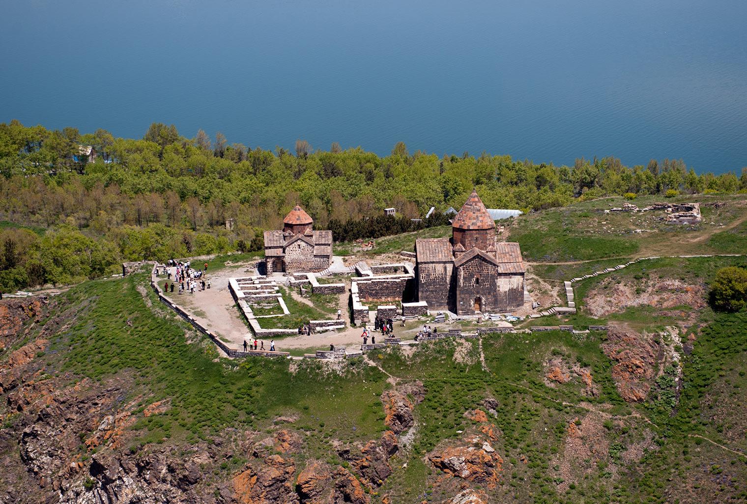 Monastery on green land overlooking the sea