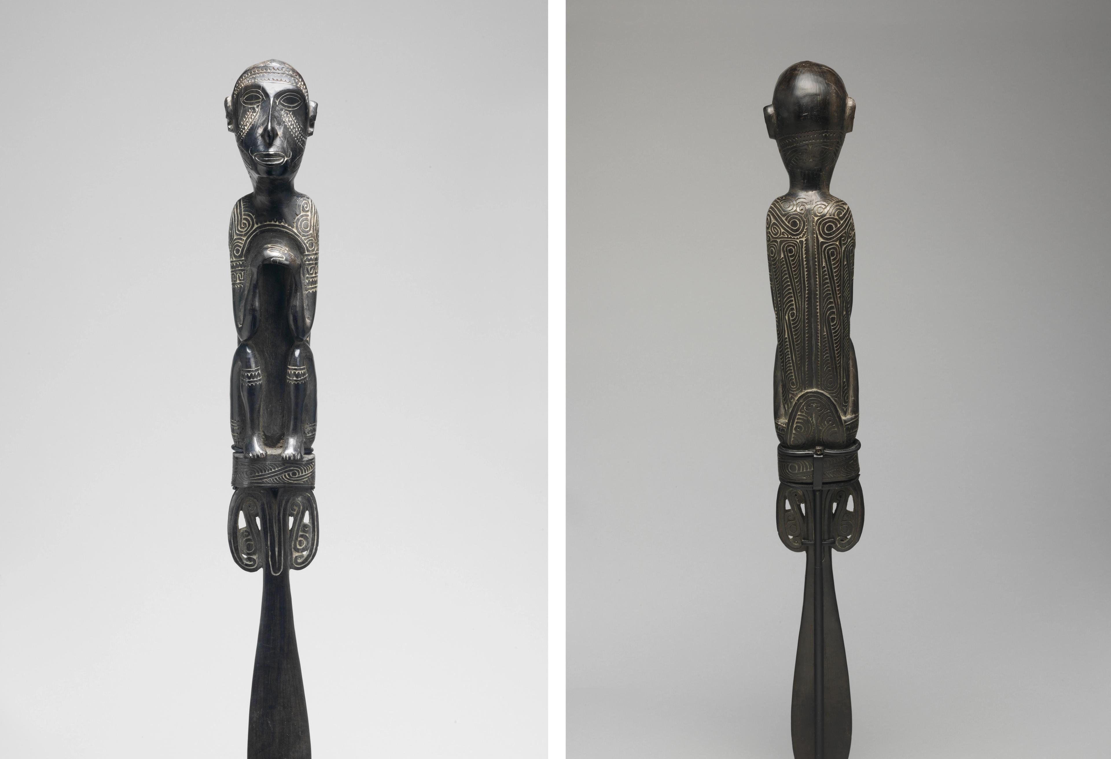 On the left, a frontal view of a carved human figure finial with hands clasped at its chest and elbows resting on bent knees. On the right, a view of the same object from the back.
