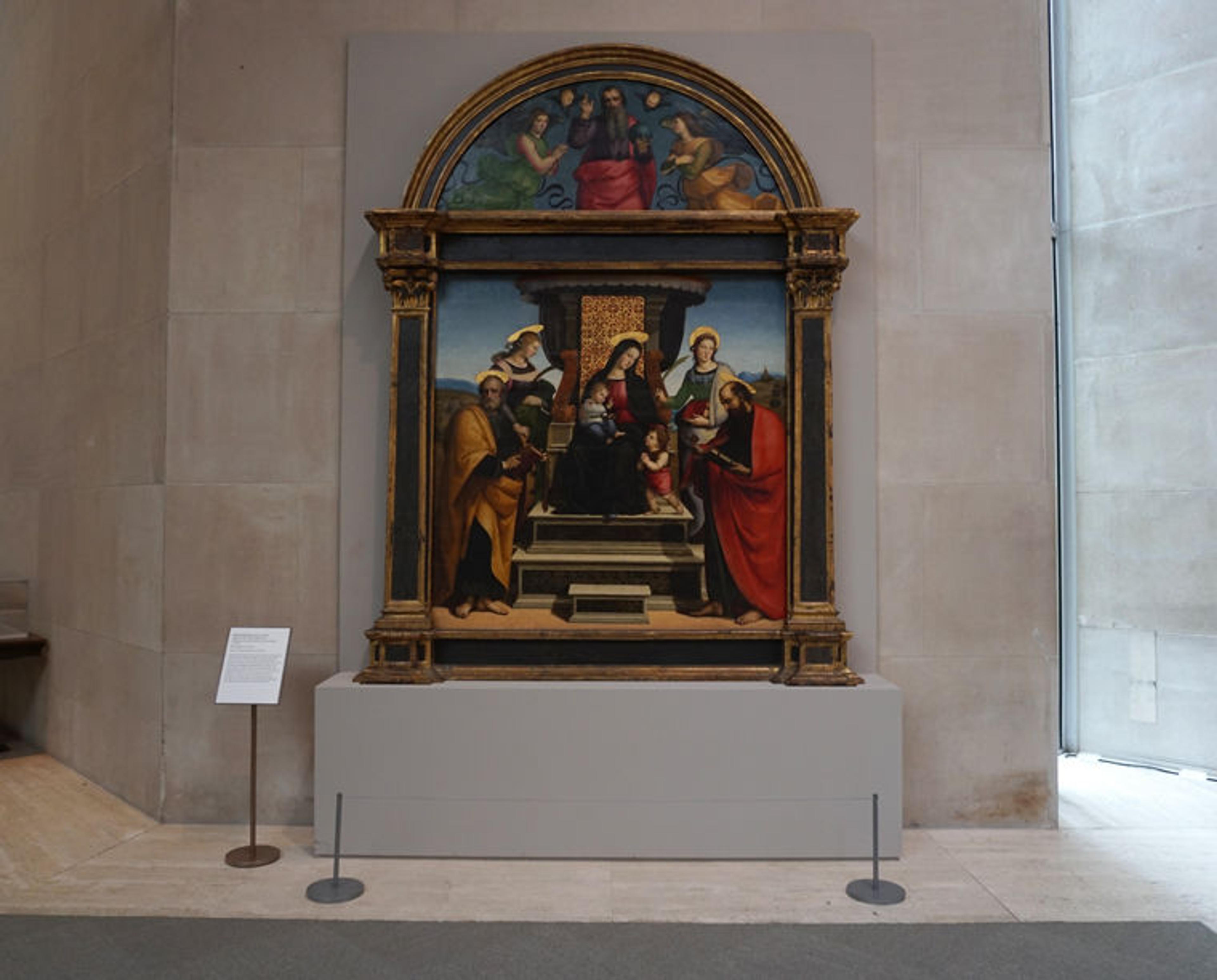 Installation view of Raphael's 'Madonna and Child Enthroned with Saints' in a gallery in The Met's Robert Lehman Wing