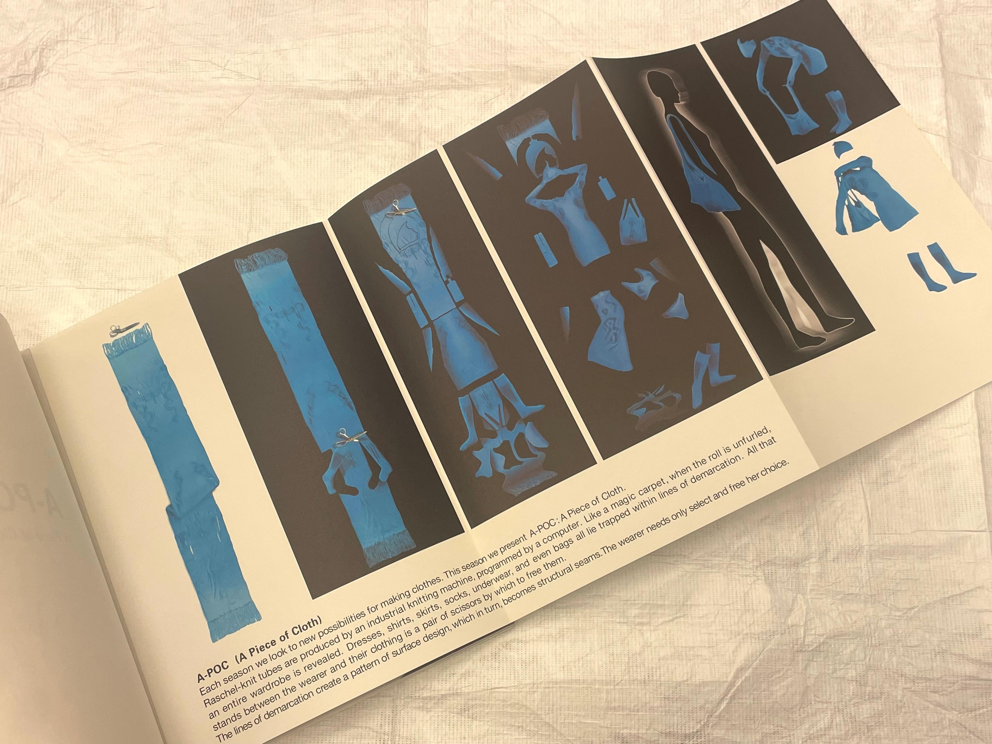 Spread featuring clothes that are blue against a black background