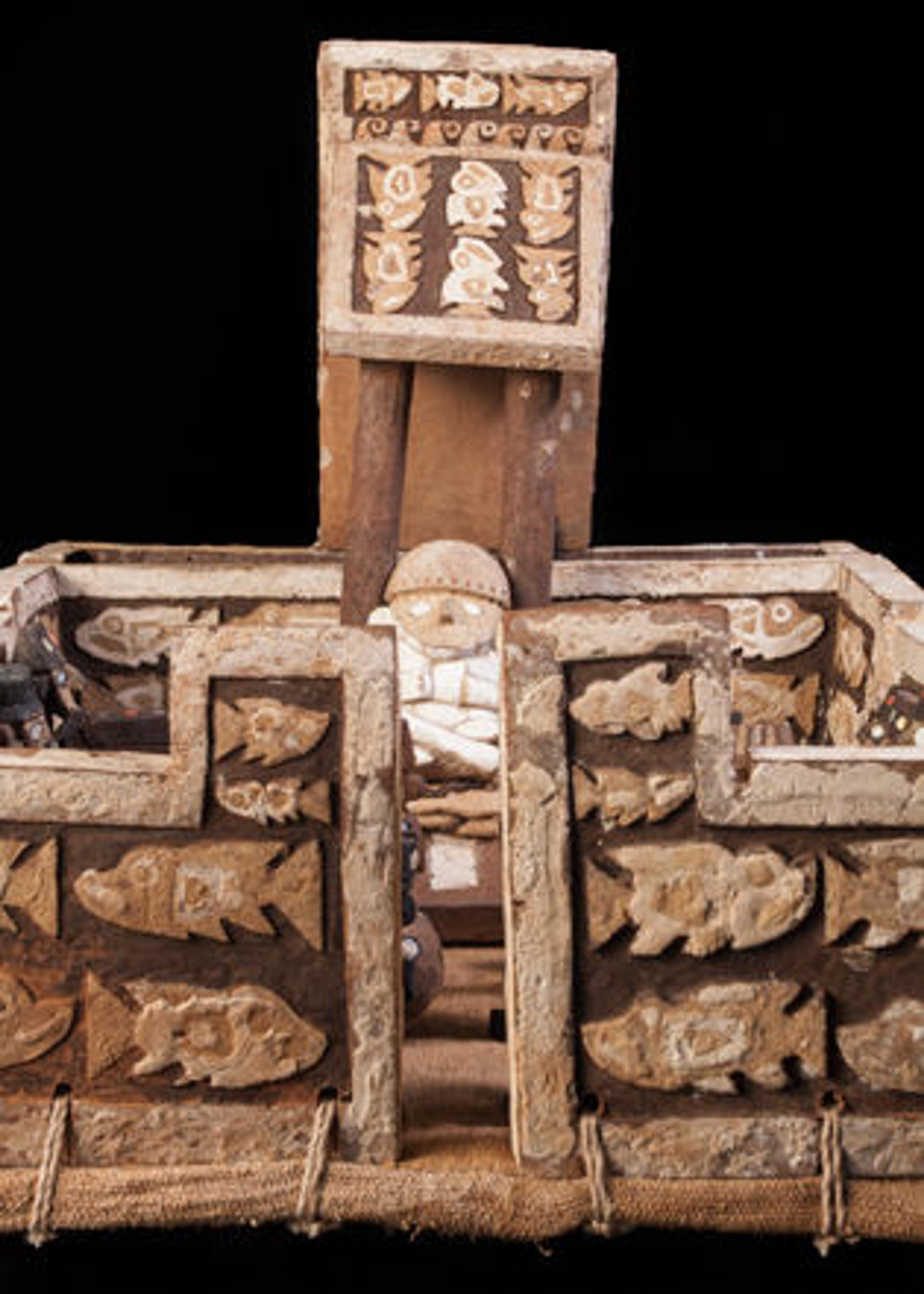 Left: In this detail of palace model with figures, we are looking through the entrance to one of the palace courtyards, toward the figure of a mummy.