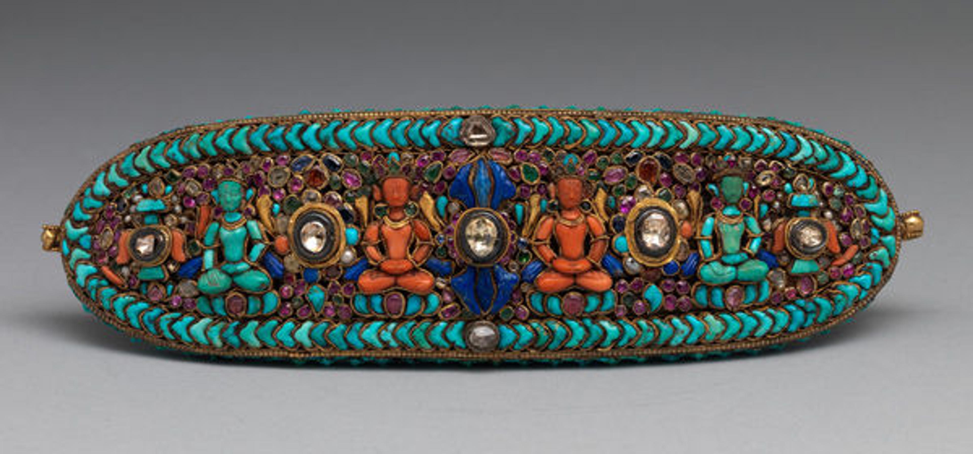 Forehead ornament for a deity, 17th–19th century. Newari for Nepal or Tibet market. Gold, diamonds, rubies, emeralds, sapphires, lapis lazuli, coral, shell and turquoise; 2 3/4 x 8 1/2 in. (7 x 21.6 cm). The Metropolitan Museum of Art, New York, John Stewart Kennedy Fund, 1915 (15.95.161)