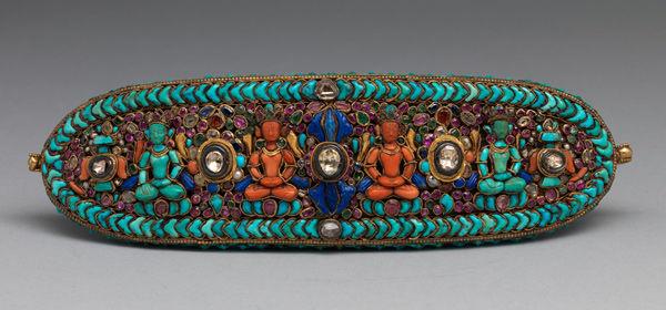 Forehead ornament for a deity, 17th–19th century. Newari for Nepal or Tibet market. Gold, diamonds, rubies, emeralds, sapphires, lapis lazuli, coral, shell and turquoise; 2 3/4 x 8 1/2 in. (7 x 21.6 cm). The Metropolitan Museum of Art, New York, John Stewart Kennedy Fund, 1915 (15.95.161)