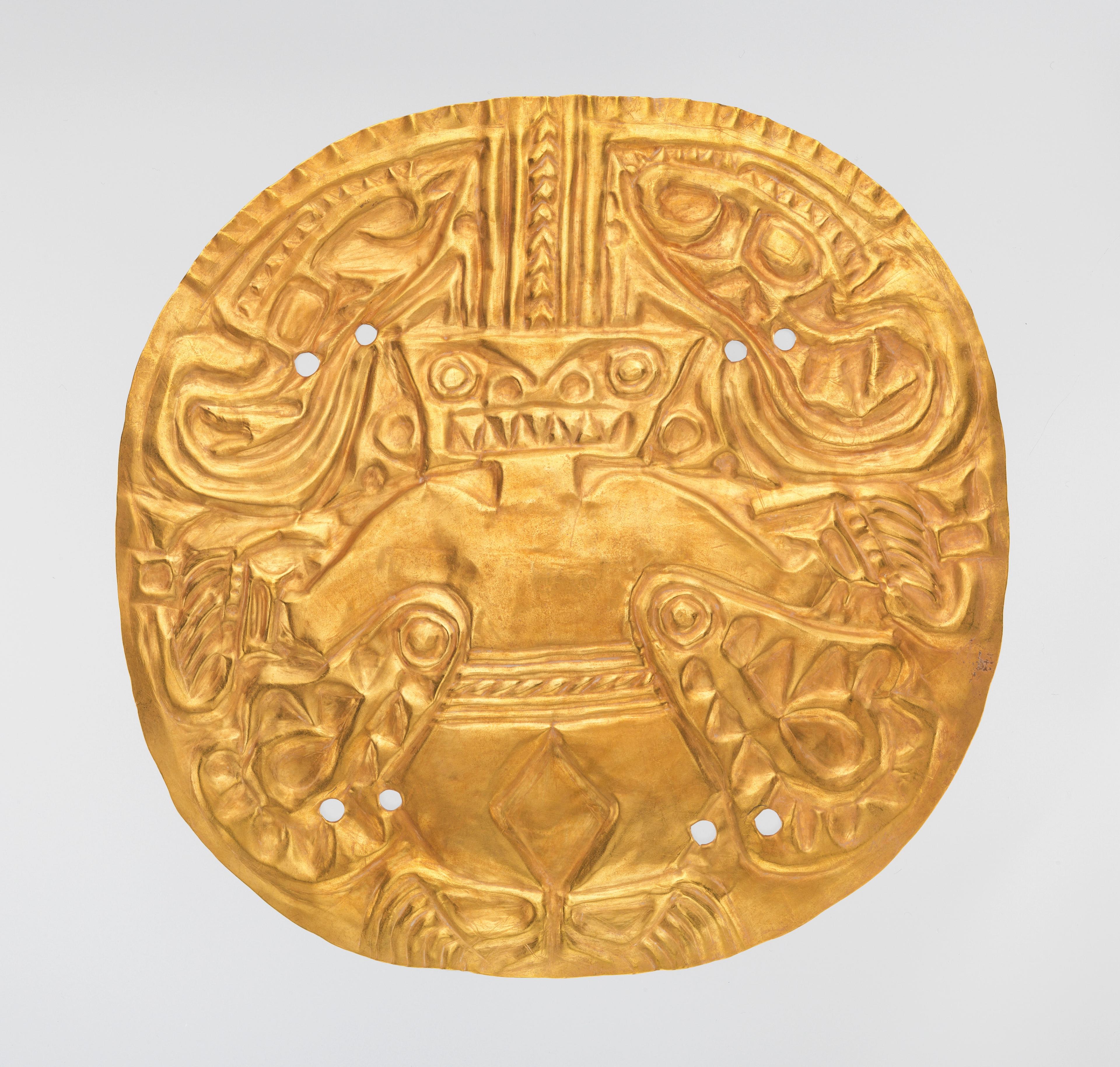 Gold plaque displaying a masked figure