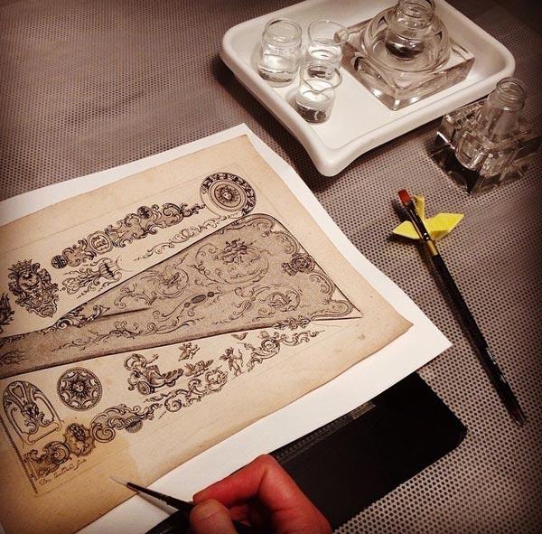 The musket stock design (2013.907) being treated on the suction platen