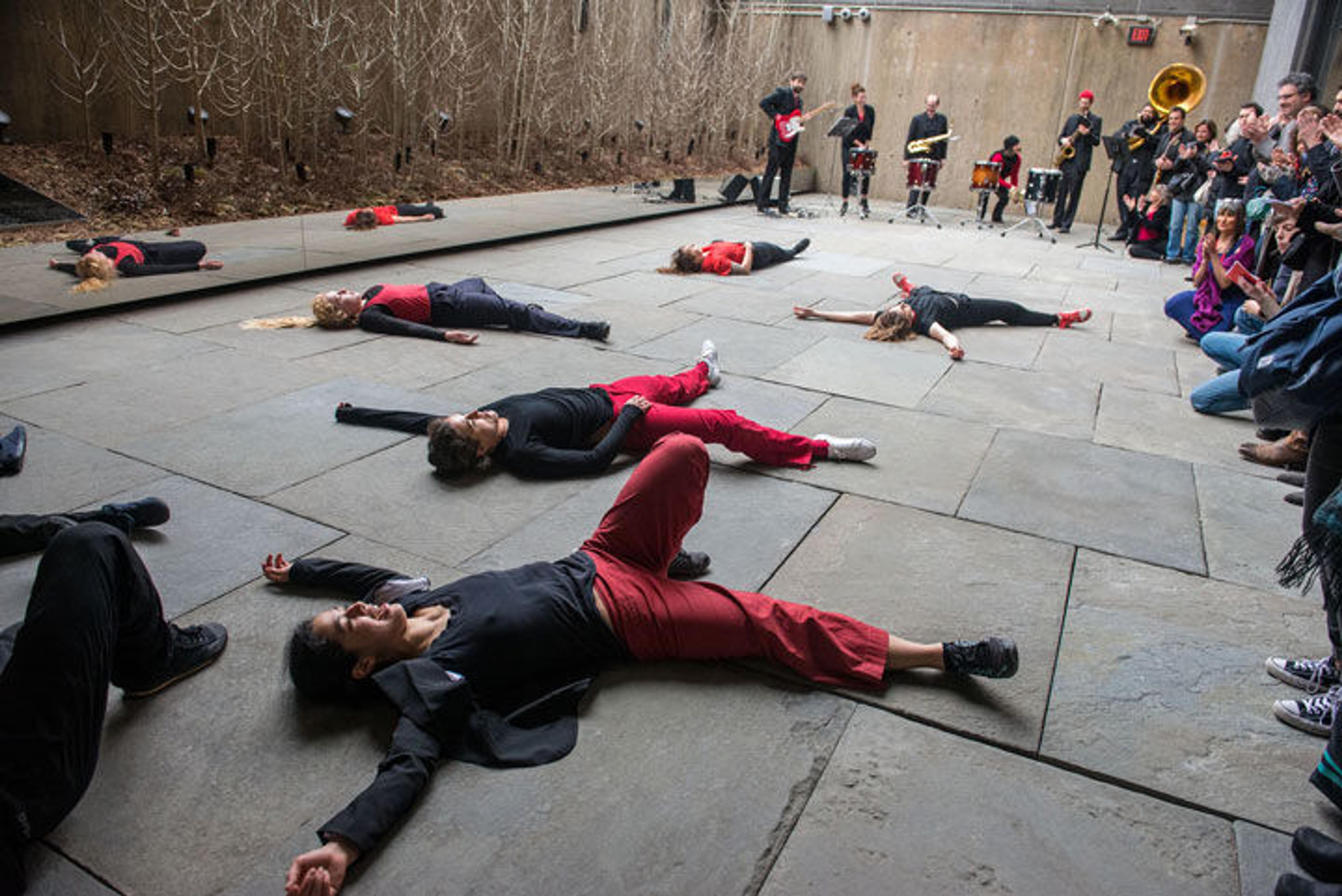 A group of dancers perform in the outdoor space at The Met Breuer