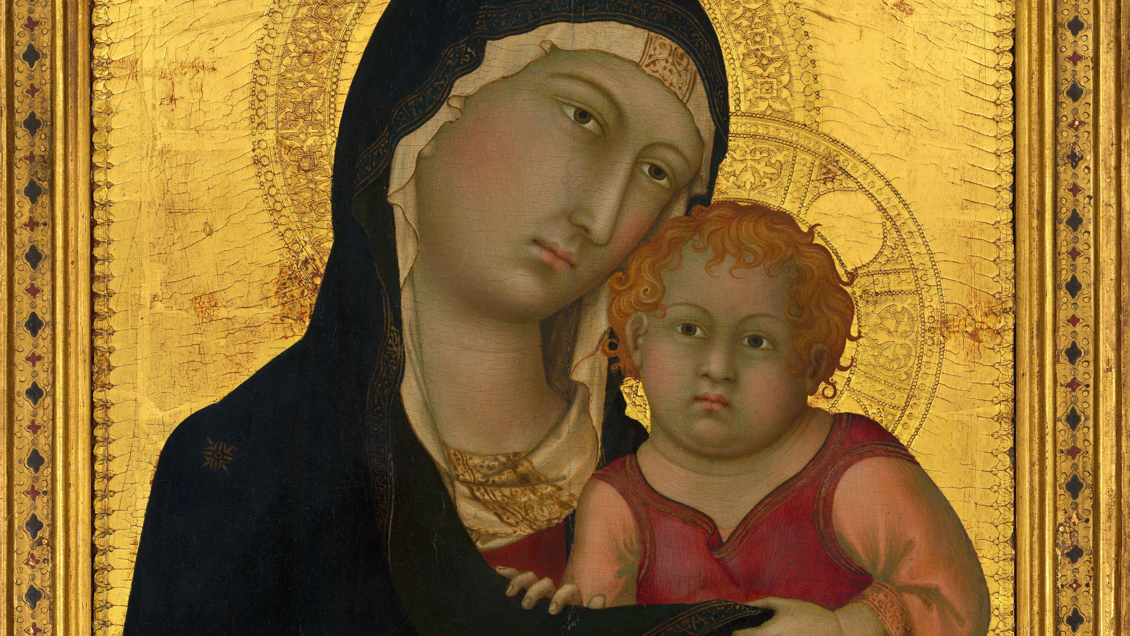 A medieval painting of the madonna and child, featuring the virgin mary in a blue mantle holding the infant jesus clad in red, set against a gold-leaf background adorned with intricate patterns.