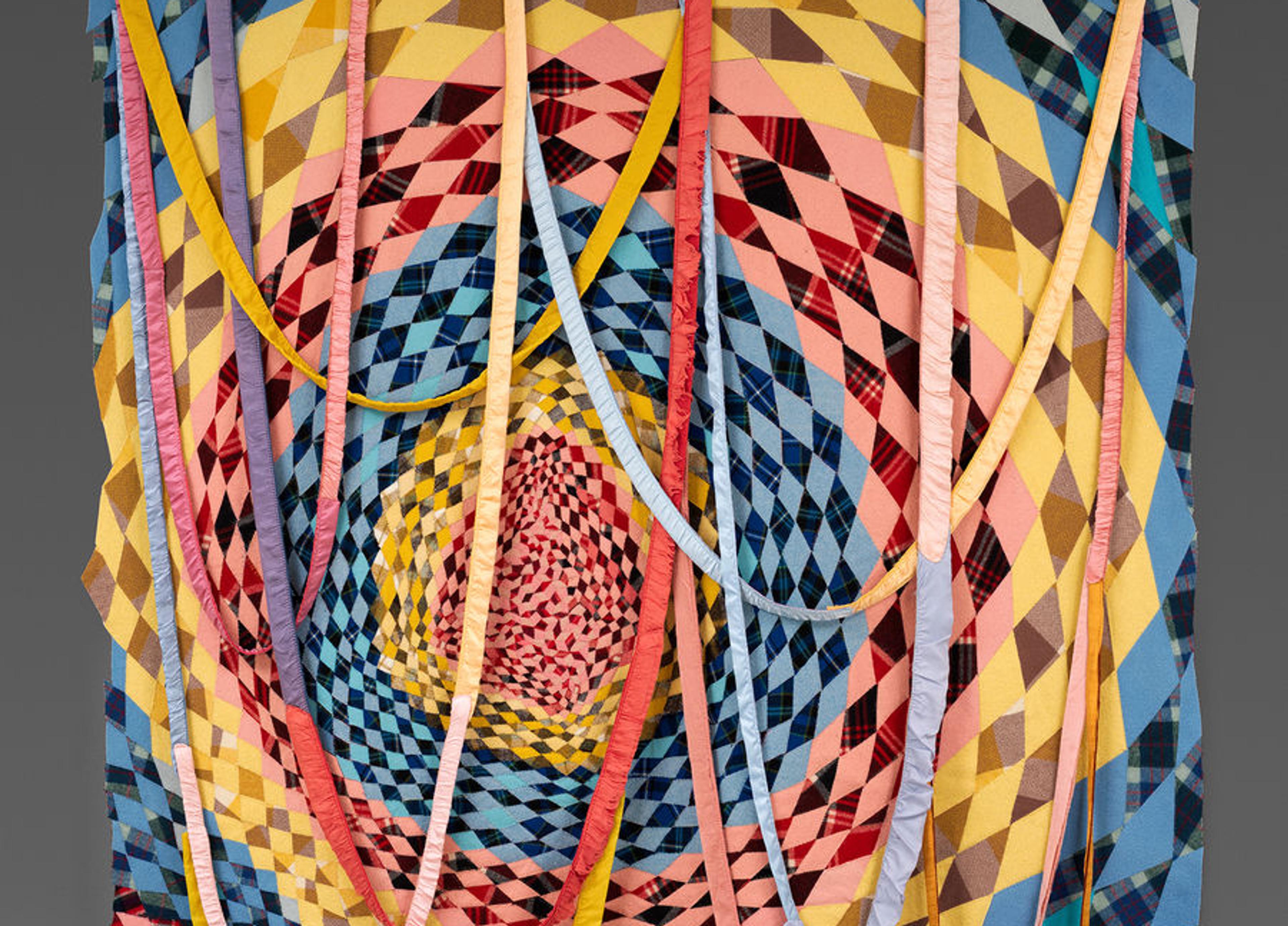 A detail of Marie Watt's Untitled (Dream Catcher) comprised of multi-colored wool blankets.