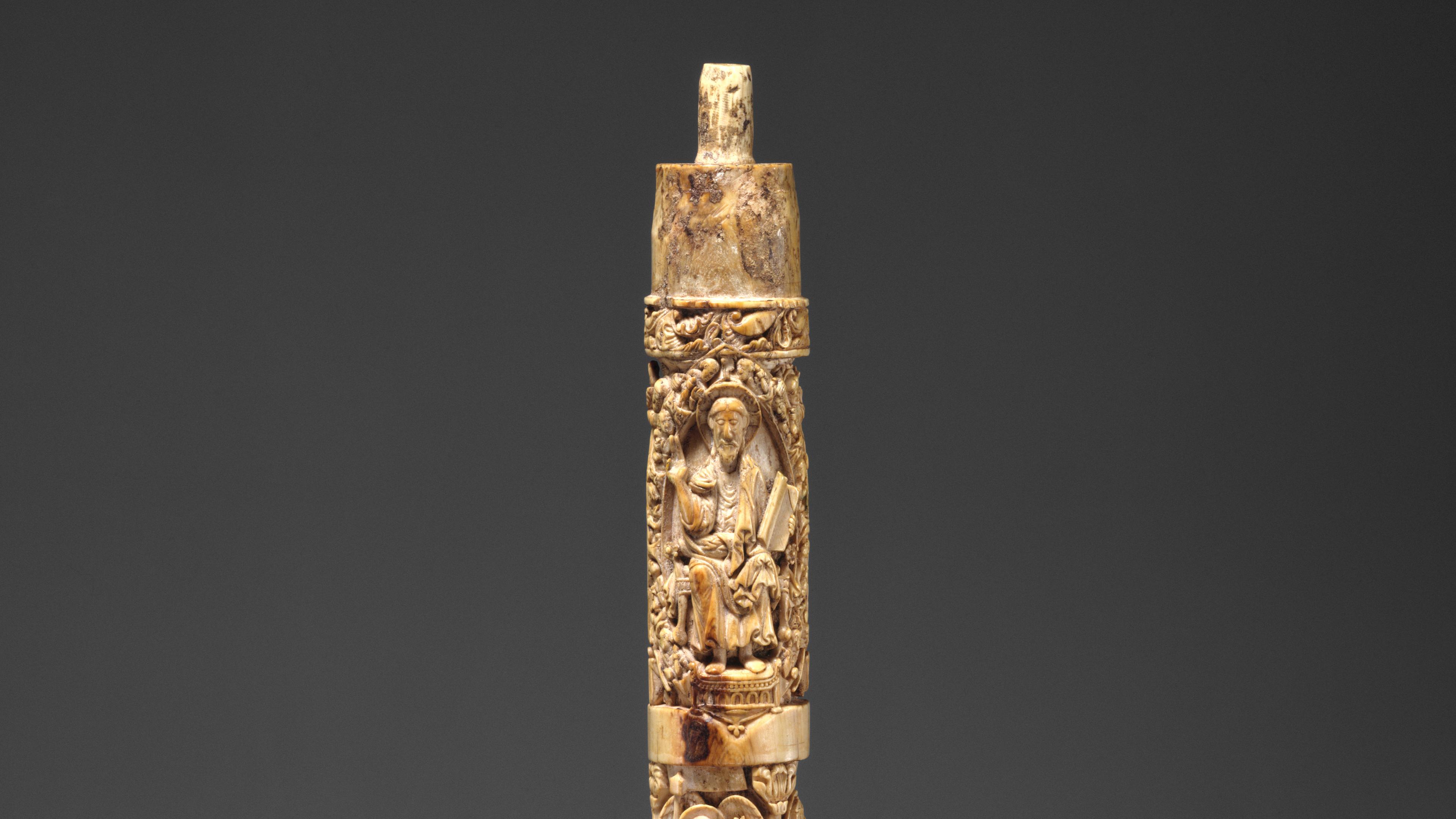 Detail of an ivory carving showing a robed, older man
