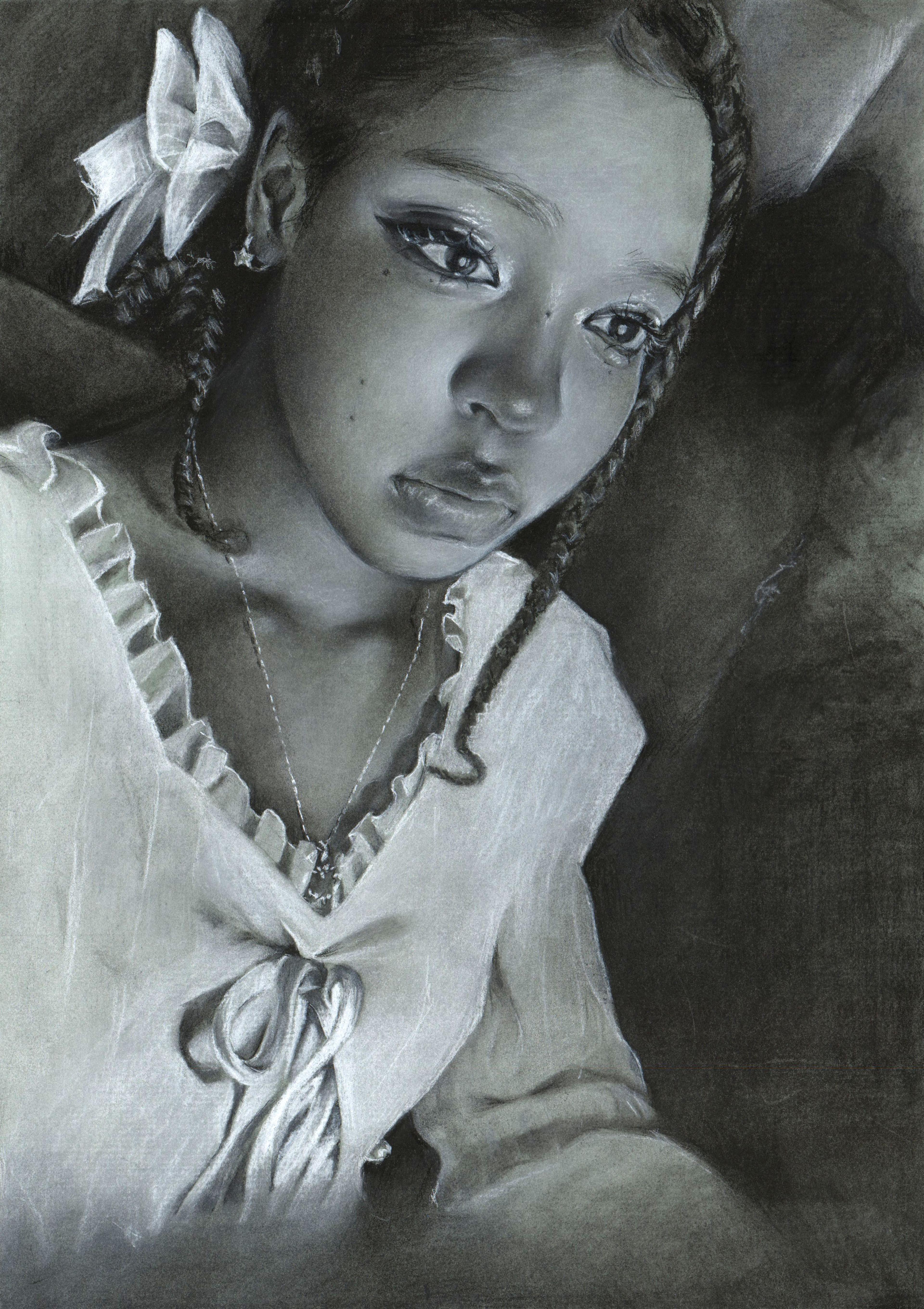 Black-and-white charcoal self-portrait of an adolescent Black girl facing right. She has long, thin, dark braids, small star-shaped earrings, and a tied white bow on the back of her head, behind her right ear. She wears a white frilled blouse with a tied bow under the neckline, with a thin necklace hanging down to the neckline of the blouse. She is drawn at a slight diagonal pitch, tilted downward from the upper right to the lower left in a shadowy setting.