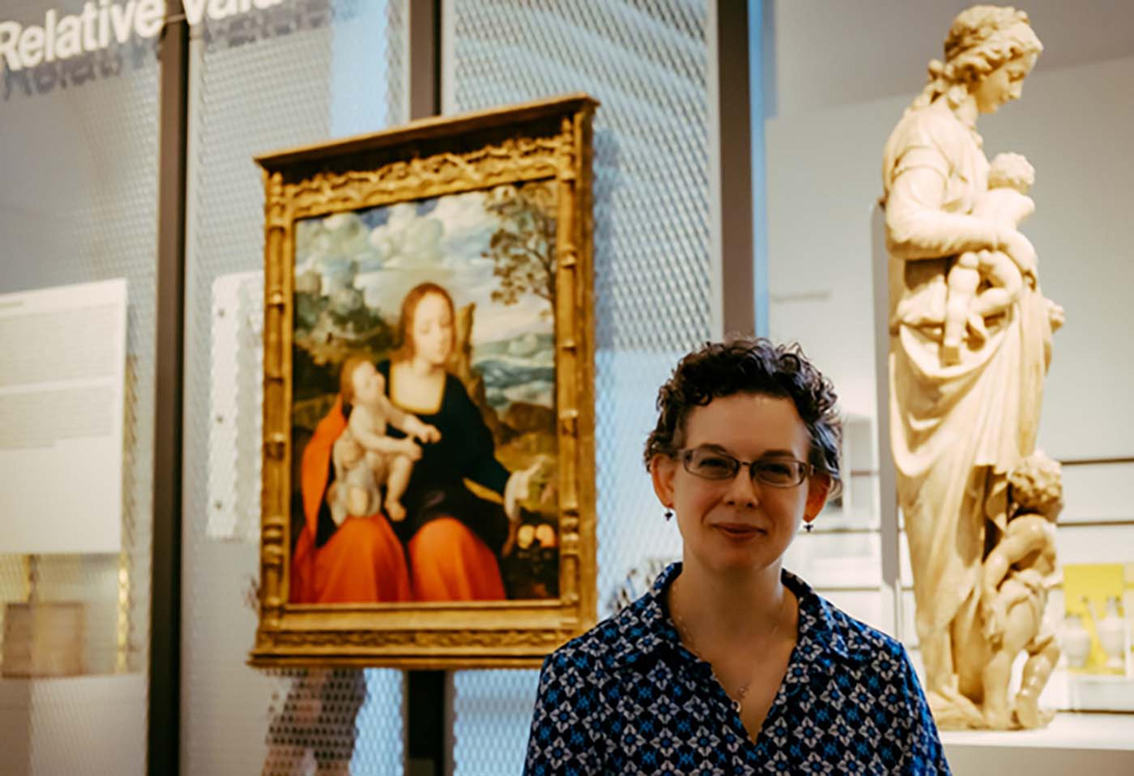 Curator Elizabeth Cleland standing in front of objects in Relative Values exhibition at The Met Fifth Avenue
