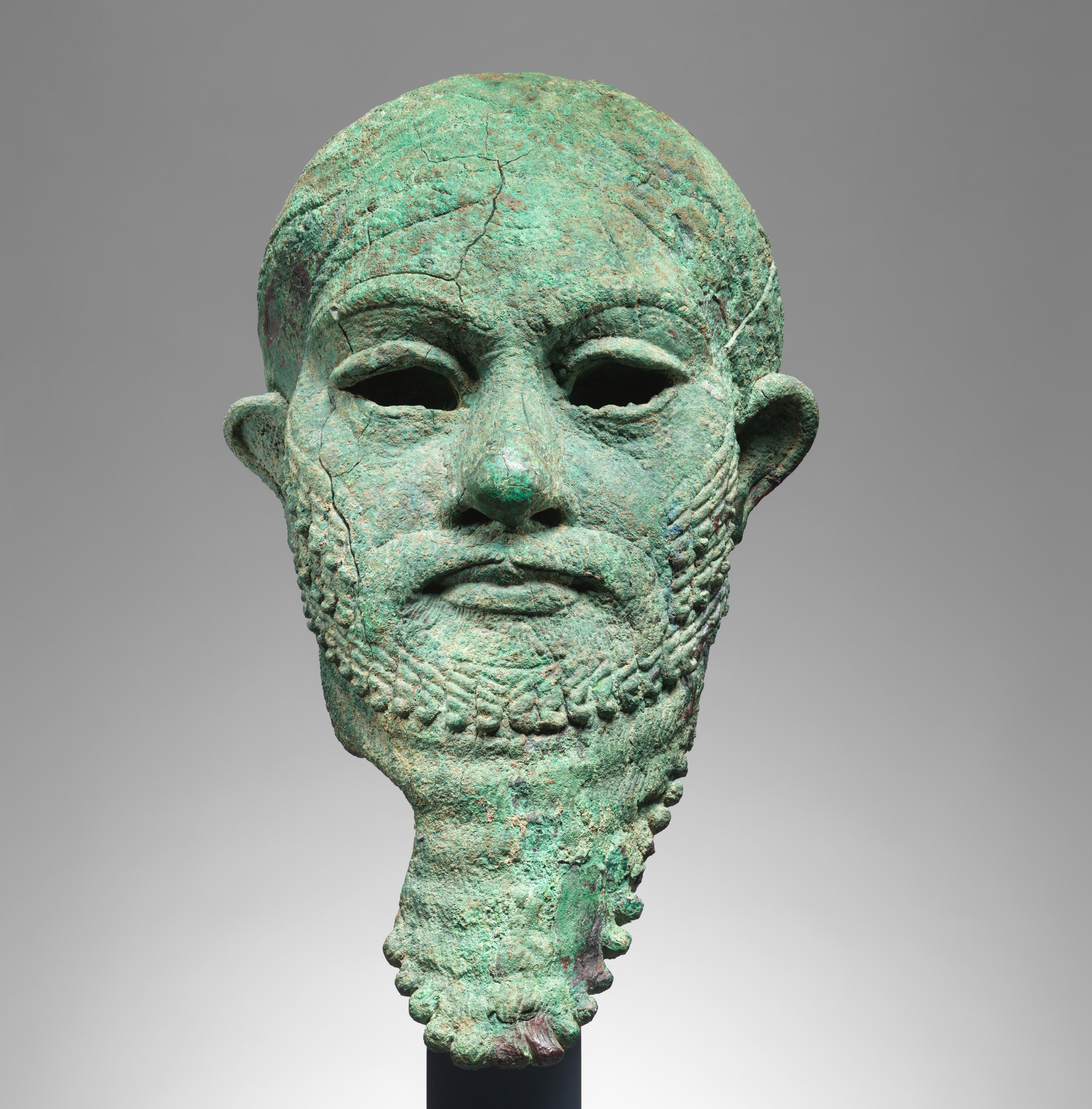 Ancient Near Eastern head of a ruler cast in copper alloy.
