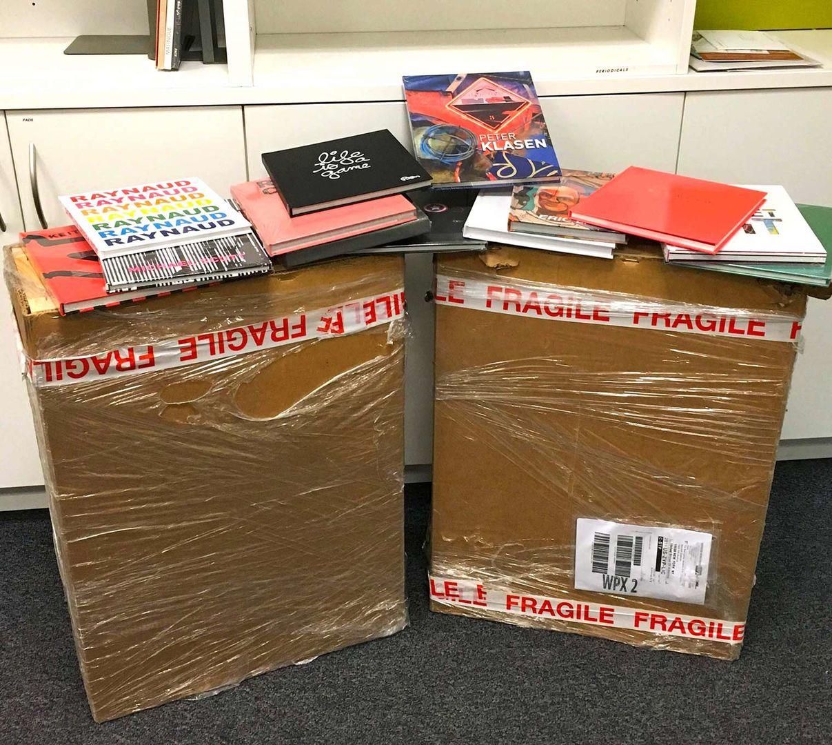 Two large shipping boxes filled with catalogs