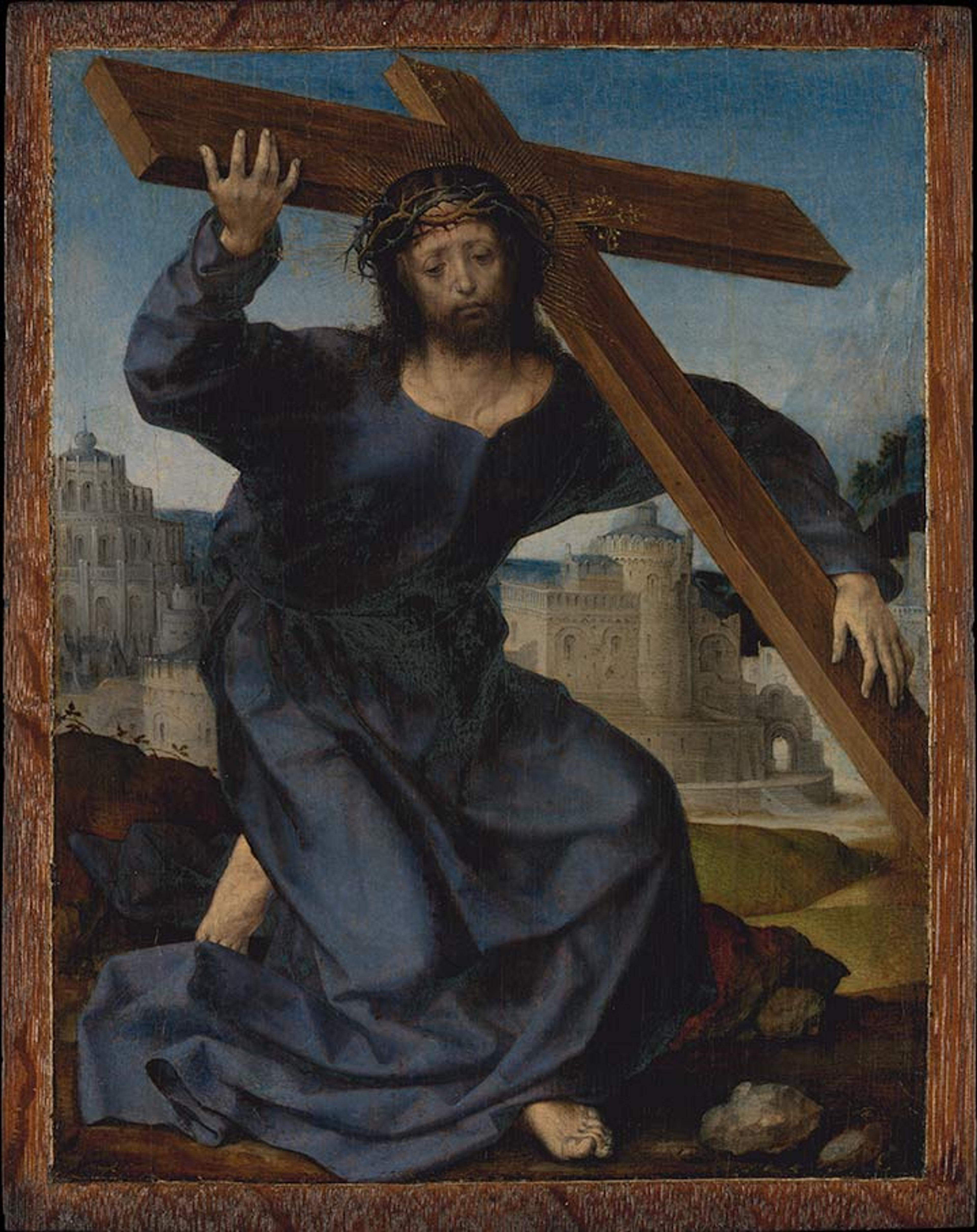 Christ wearing a dark blue robe and carrying the cross