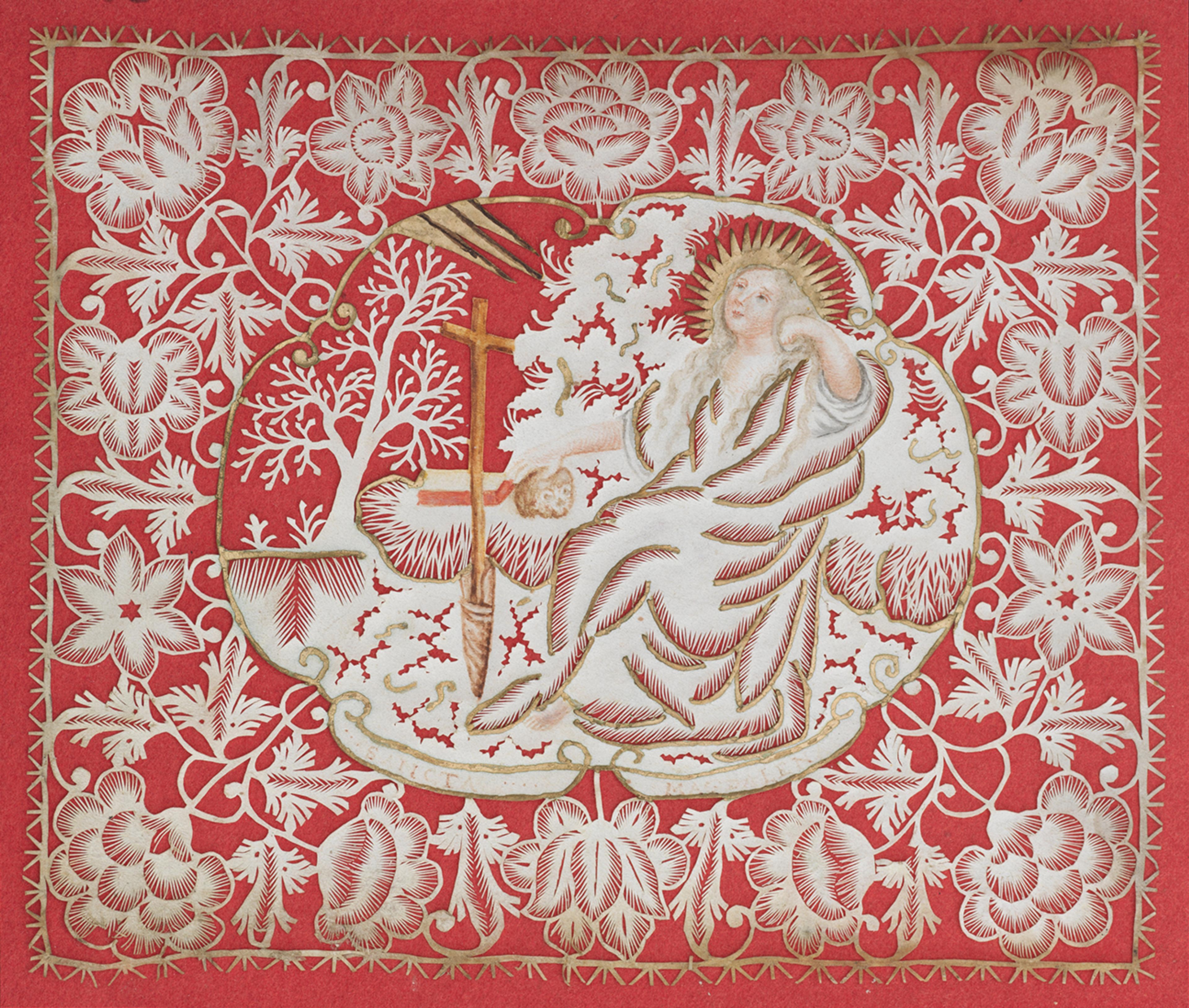 Cut paper devotional of a reclining Mary Magdalene with floral border mounted on red paper.