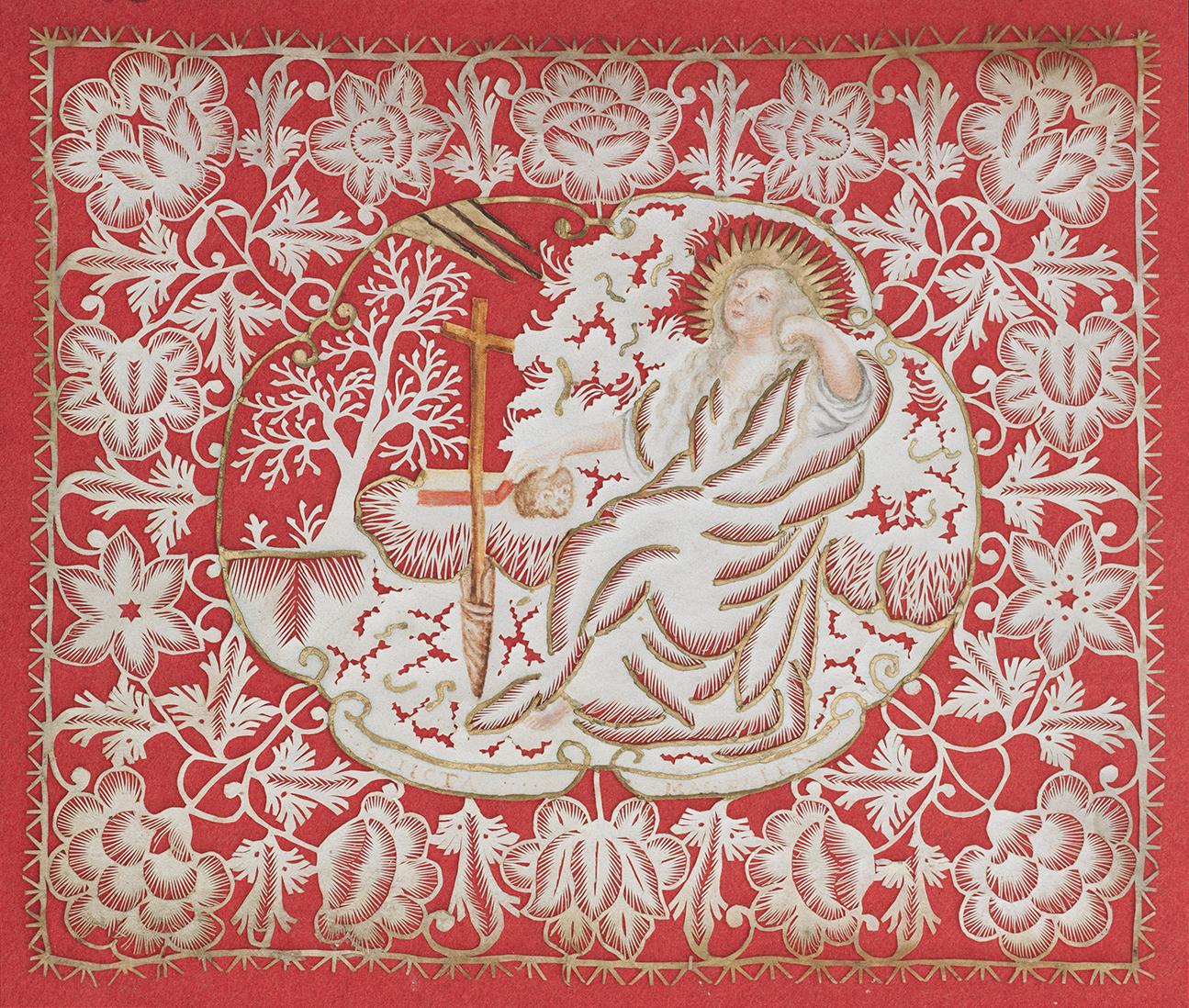 Cut paper devotional of a reclining Mary Magdalene with floral border mounted on red paper.