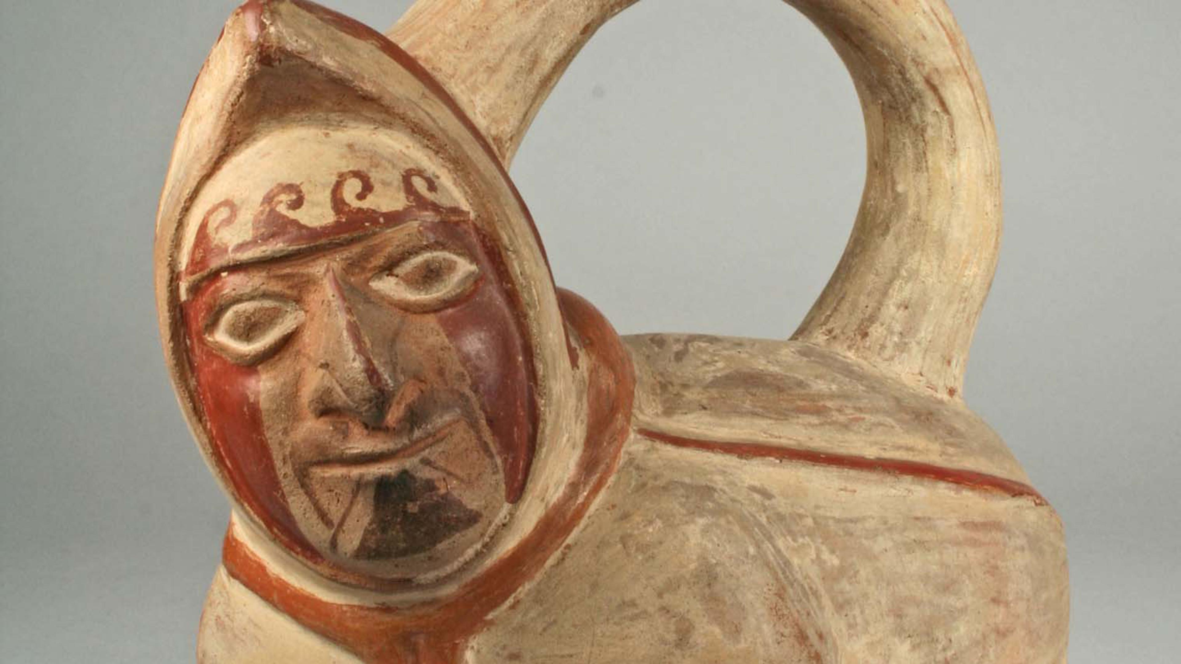A close of of a face in a moche head-vessel portrait.
