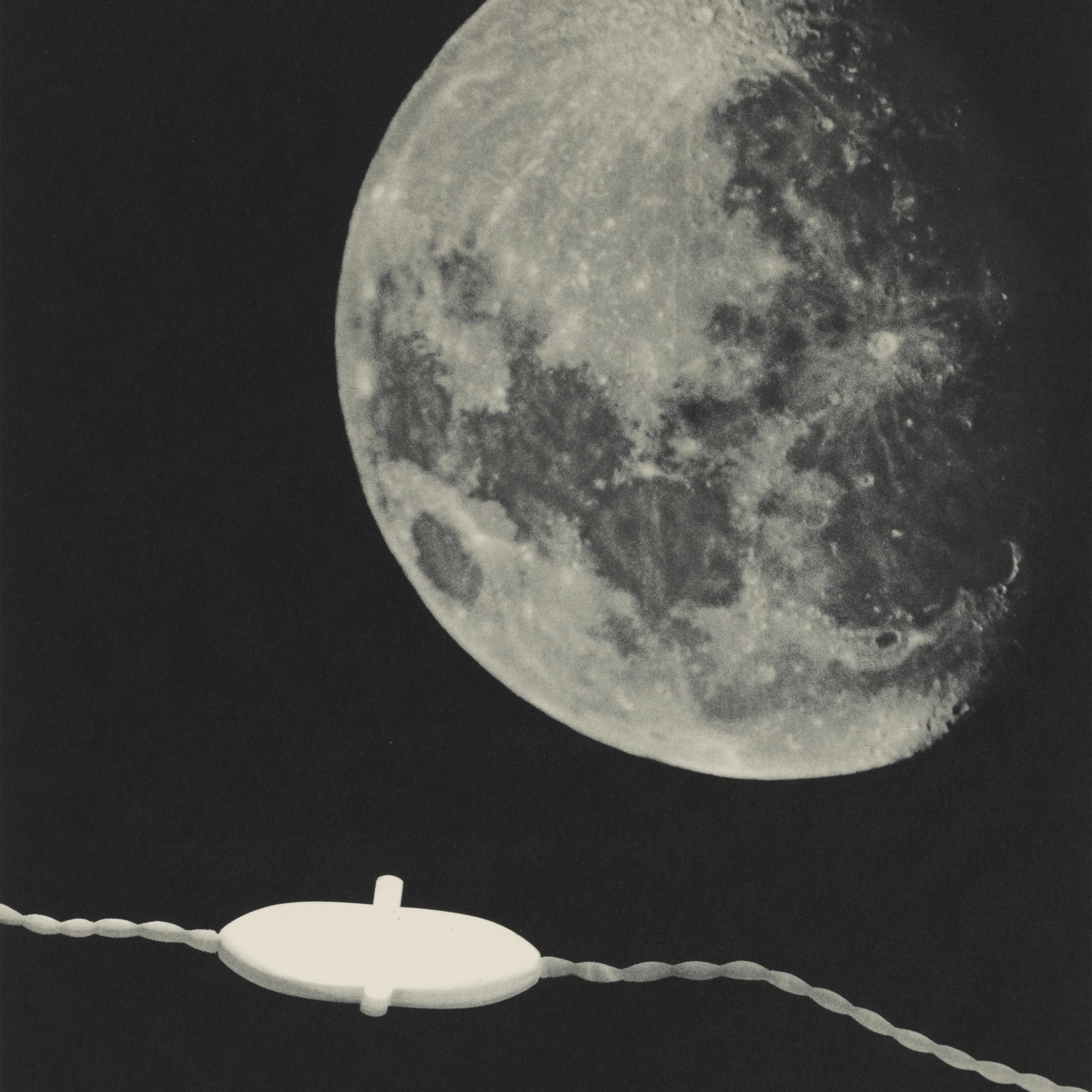 A close-up of the Moon's surface shows intricate details against a dark sky. A white electrical cord runs horizontally with a switch in the foreground.