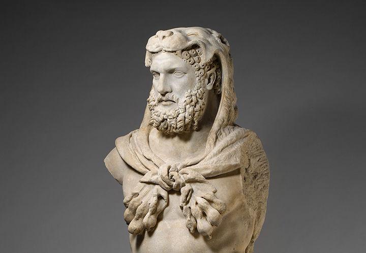 A close up of Hercules wearing a lion's skin on his head.