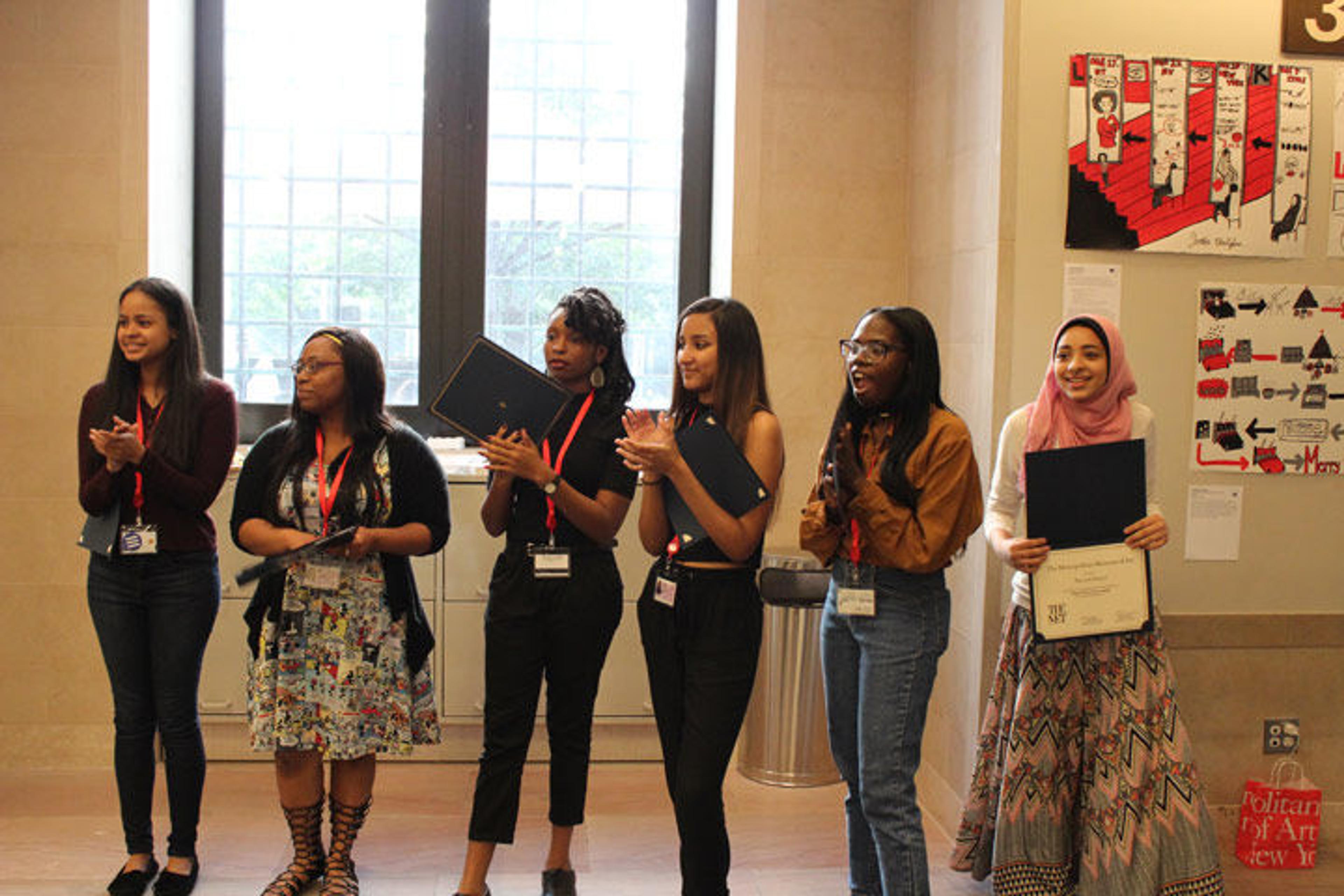 Excited Interns stand in front of the audience to be honored for their contributions to Exploring What Matters: An Exhibition by The Met High School Interns
