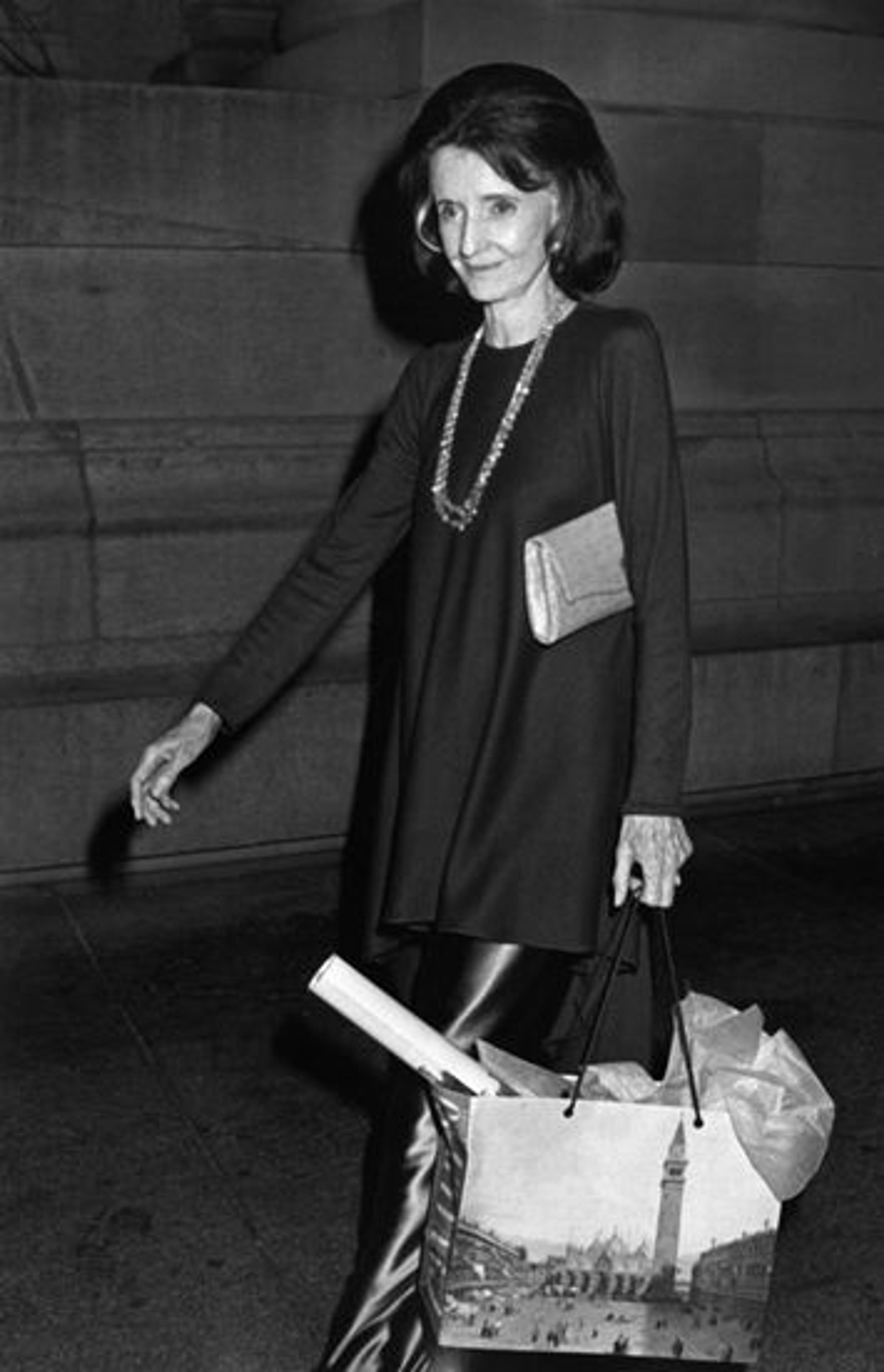 A black-and-white photo of Jayne Wrightsman attending an exhibition opening at The Metropolitan Museum of Art