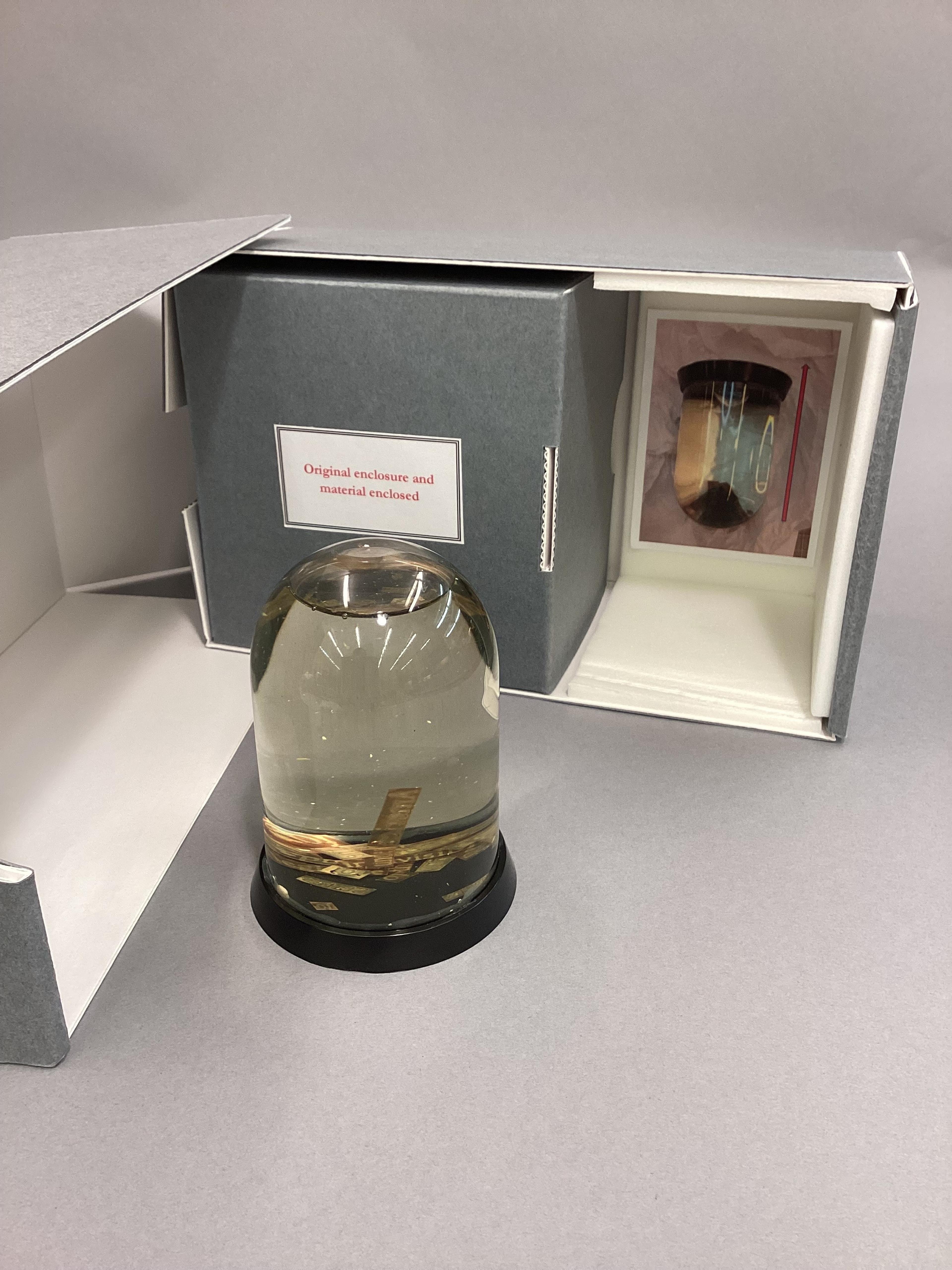 Snow globe-like object in an library box