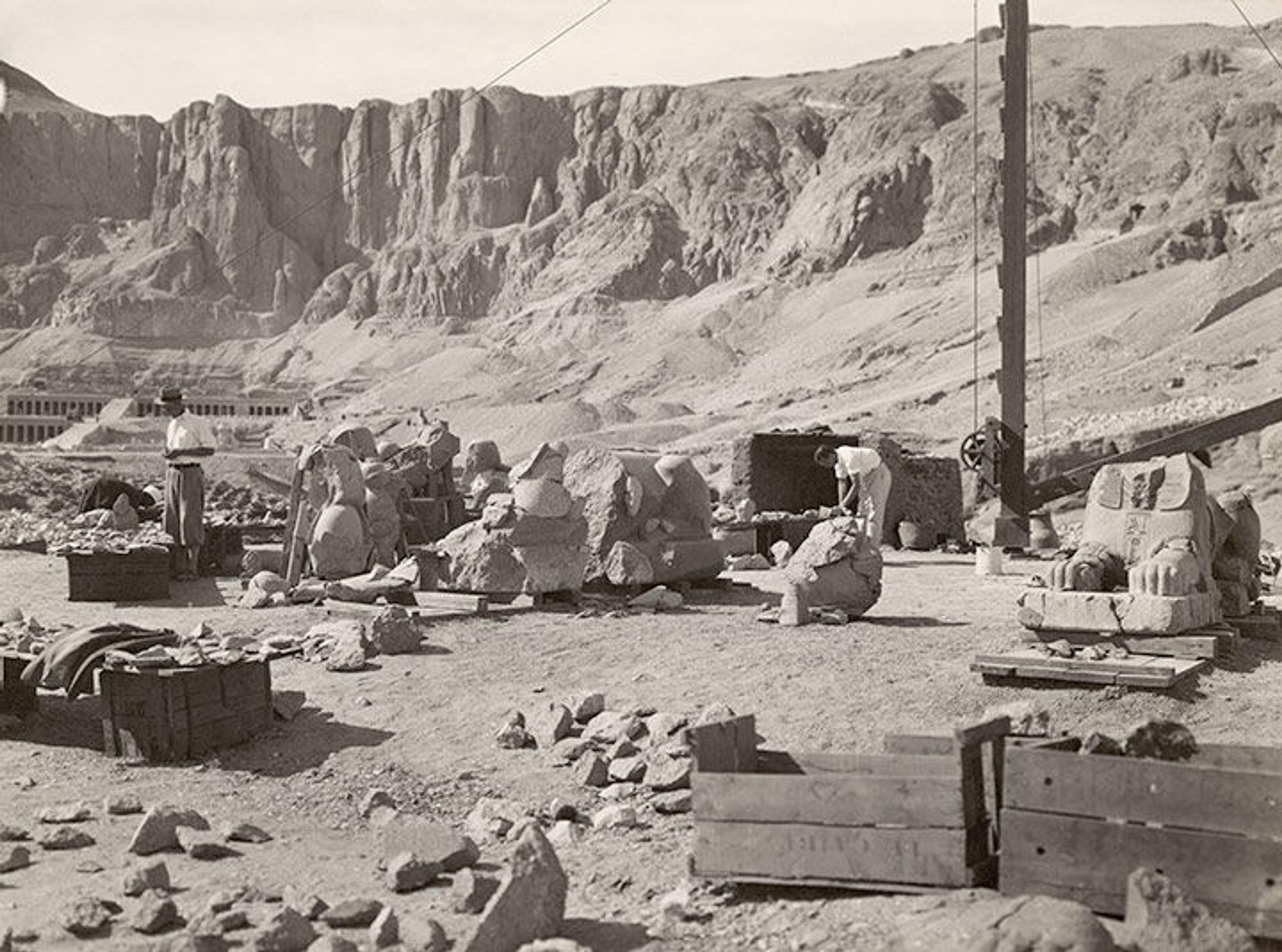 Excavators from an 1928–29 expedition at Deir el-Bahri sorting fragments of granite statues