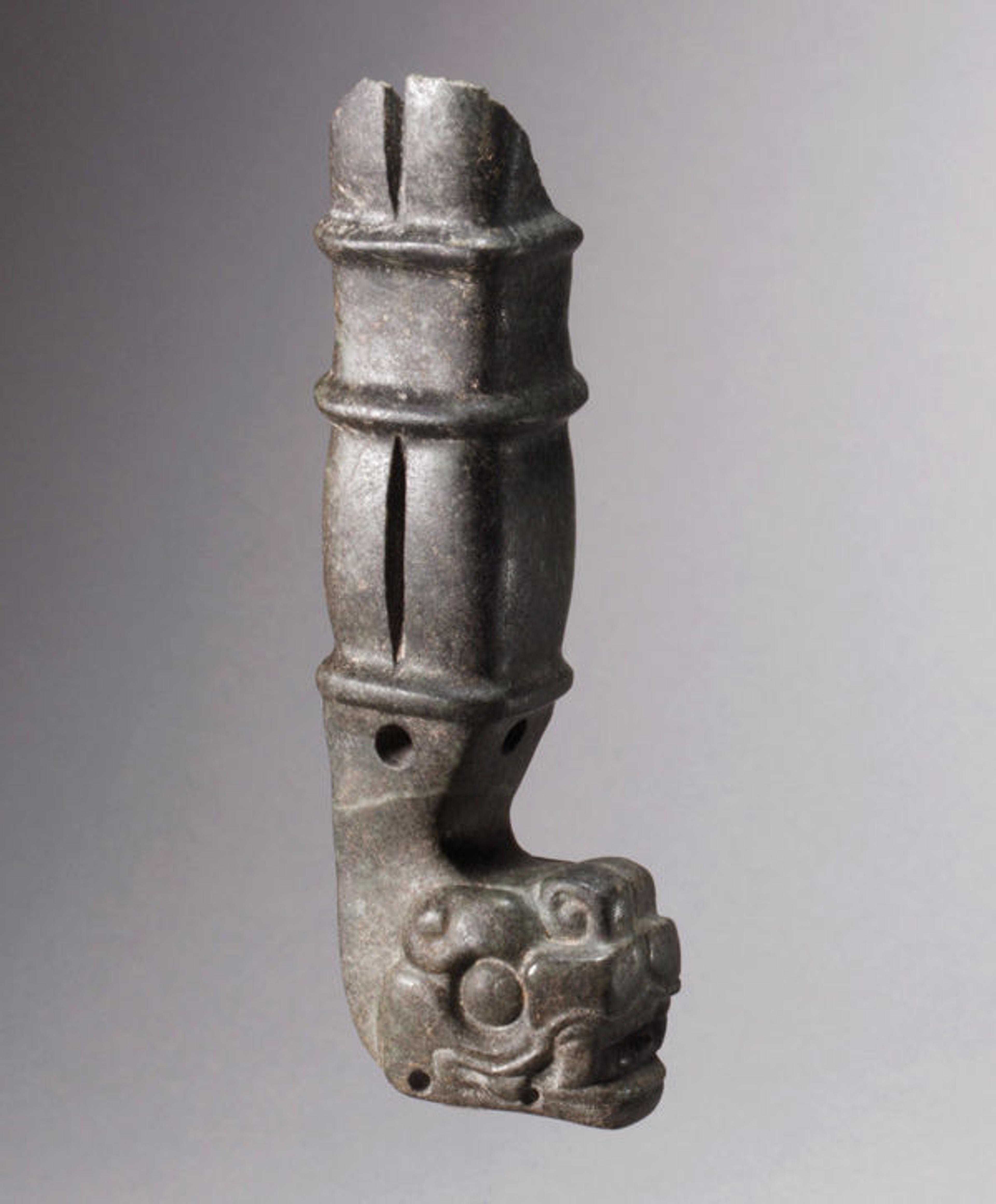 Fig. 1. Ceremonial handle, 7th—9th century. Mexico or Guatemala, Mesoamerica. Maya. Jade (jadeite/omphacite); H. 5 1/2 x 1 1/8 x 1 3/4 in. (14 x 2.8 x 4.5 cm). The Metropolitan Museum of Art, New York, The Michael C. Rockefeller Memorial Collection, Bequest of Nelson A. Rockefeller, 1979 (1979.206.1132)