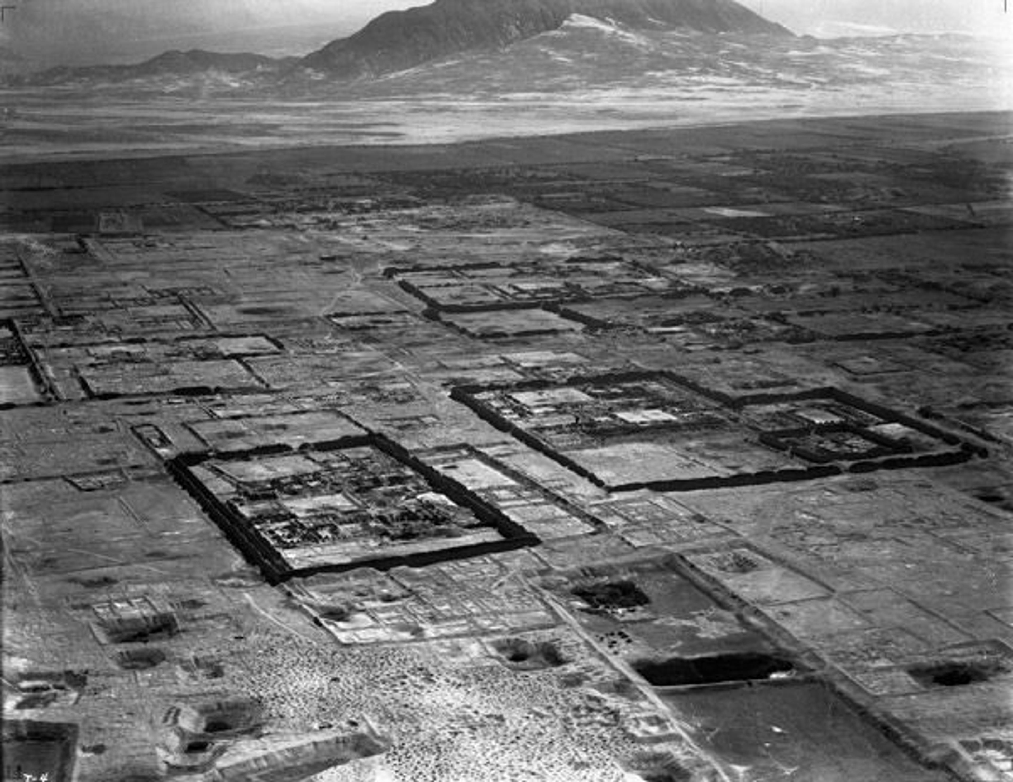 Aerial view of Chan Chan, Peru, 1931. The large enclosures were the palaces of Chimú kings. Photograph by Robert Shippee and George R. Johnson. Image courtesy of the American Museum of Natural History