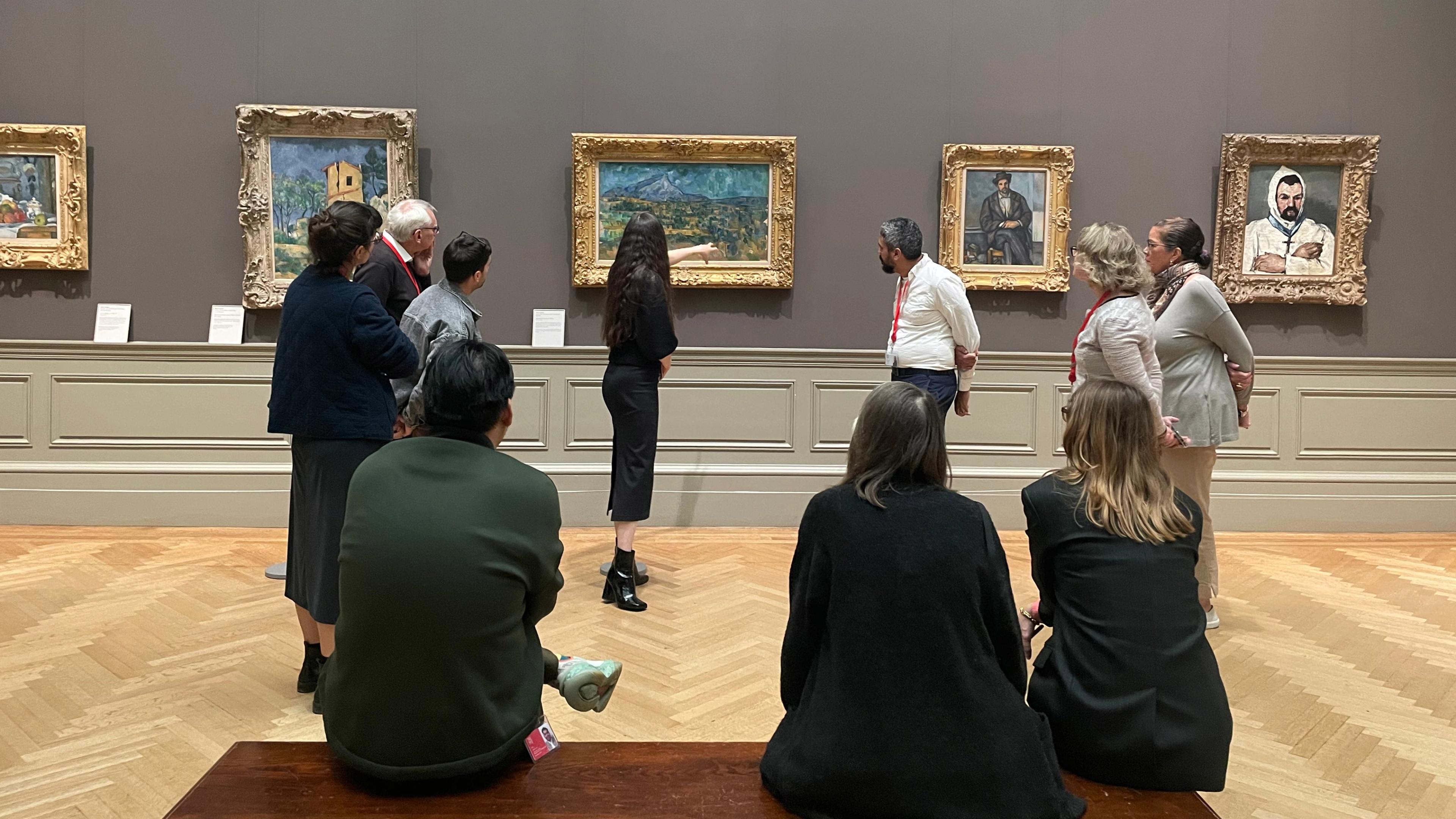Lauder fellows and Met staff during a gallery walk discussion at The Met