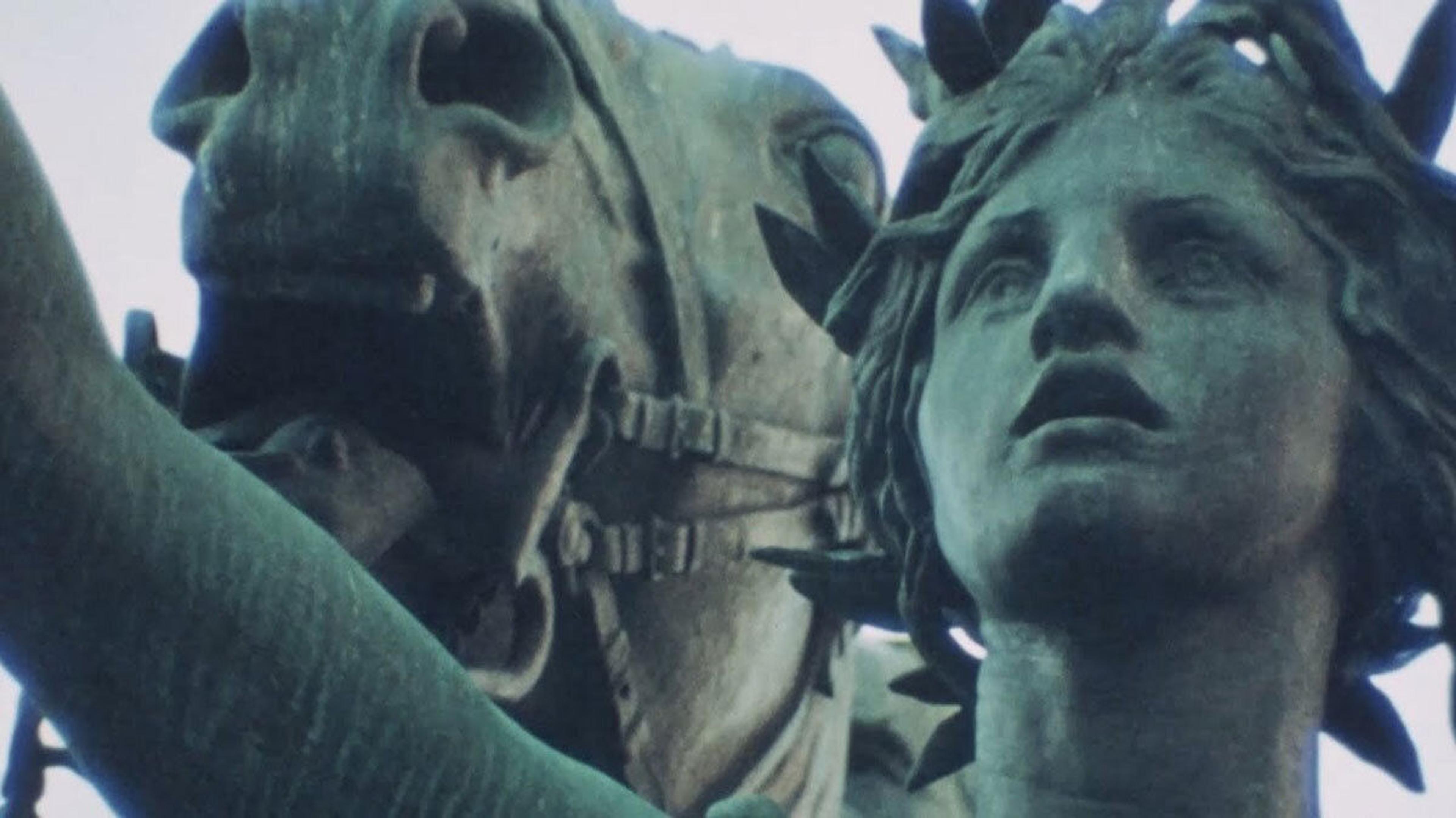 A bronze statue of a woman and a horse