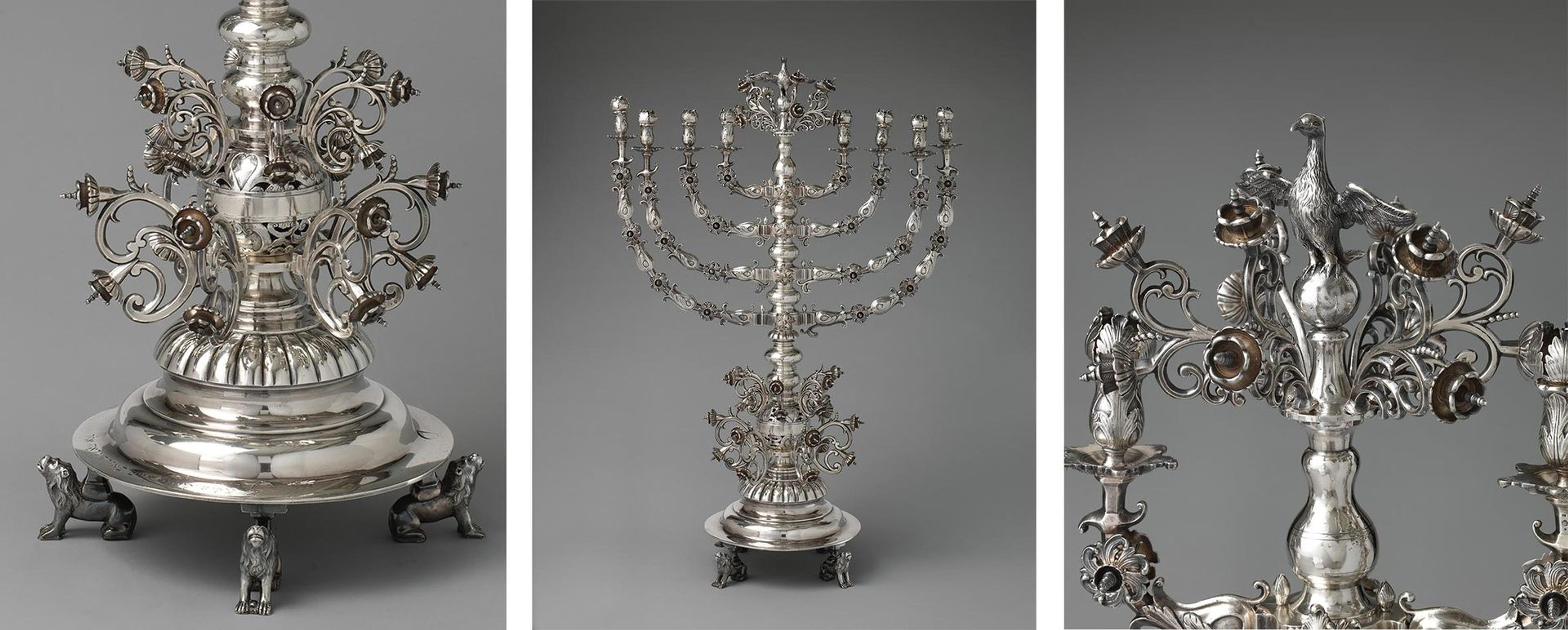 An ornate silver menorah with flowers, birds, and lions