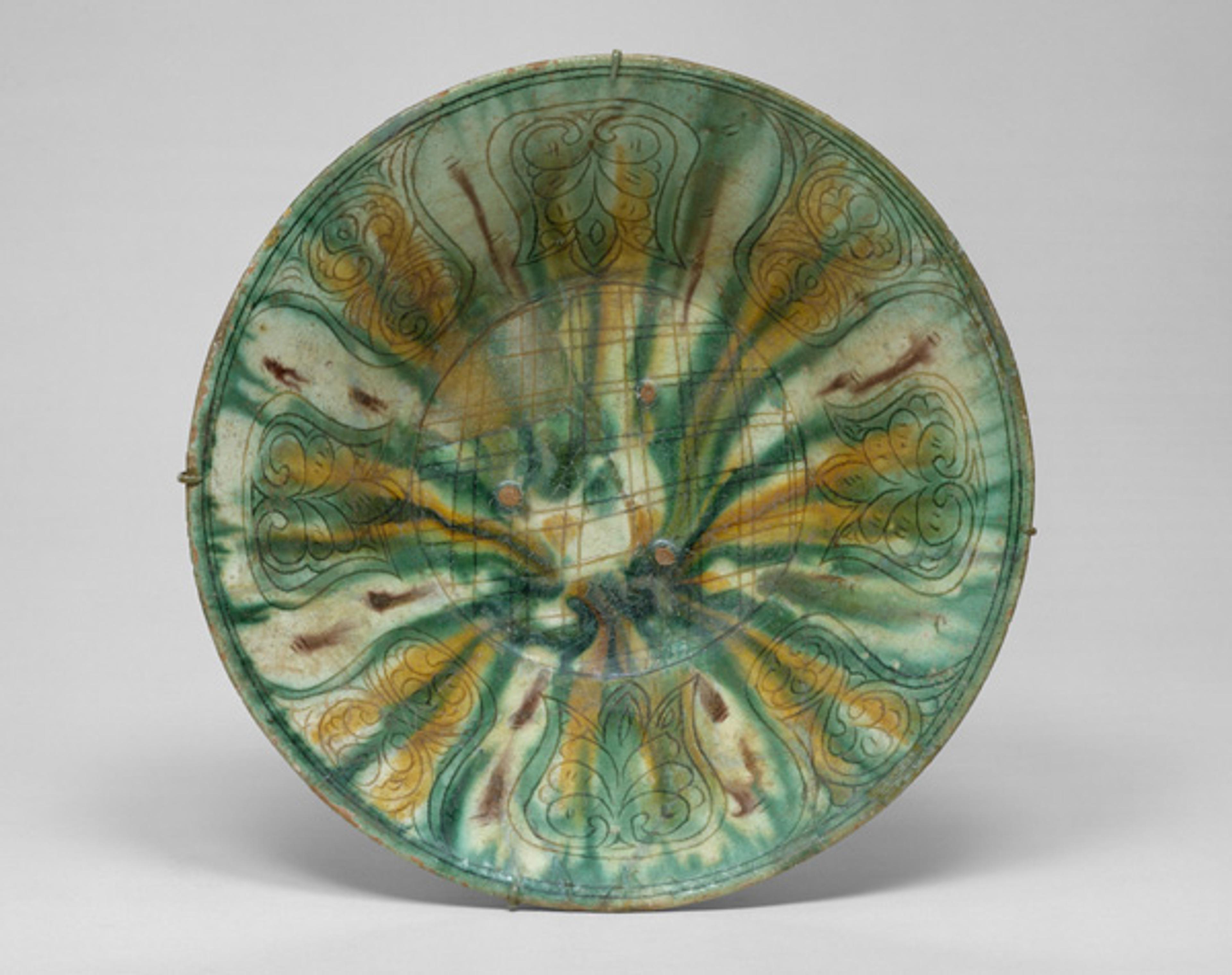 Bowl with Green, Yellow, and Brown Splashed Decoration, 10th century. Iran, Nishapur. Islamic. Earthenware; white slip, incised and splashed with polychrome glazes under transparent glaze (sgraffito ware); H. 2 7/8 in. (7.3 cm), Diam. 10 1/4 in. (26 cm). The Metropolitan Museum of Art, New York, Rogers Fund, 1938 (38.40.137)